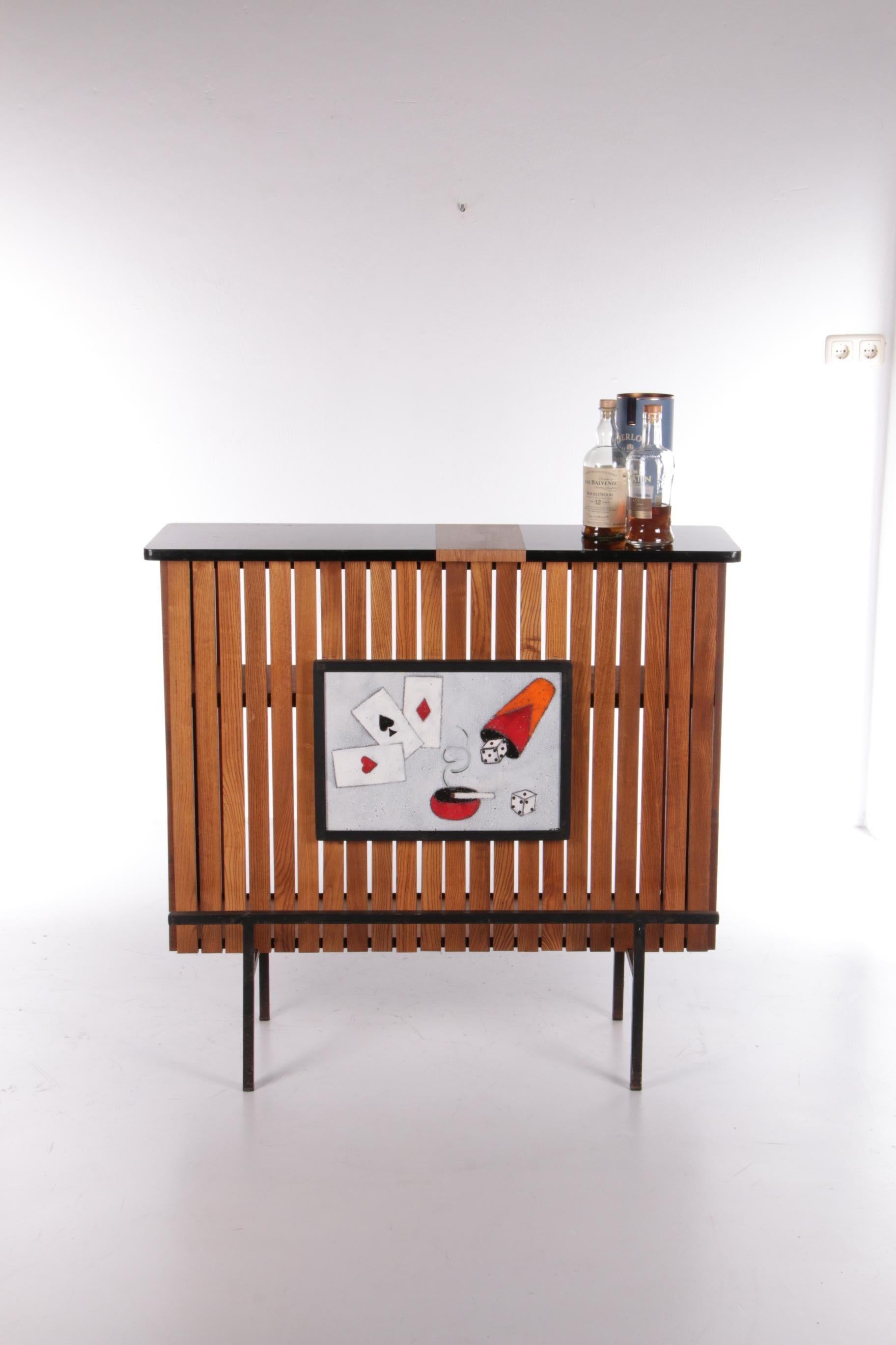 Vintage Oak Bar design by Jacques Adnet, 1960s France.


Oak and formica bar furniture. With a ceramic tile.

Original design by Jacques Adnet.

Adnet designed this piece in the 50's and it was produced in the 60's with several