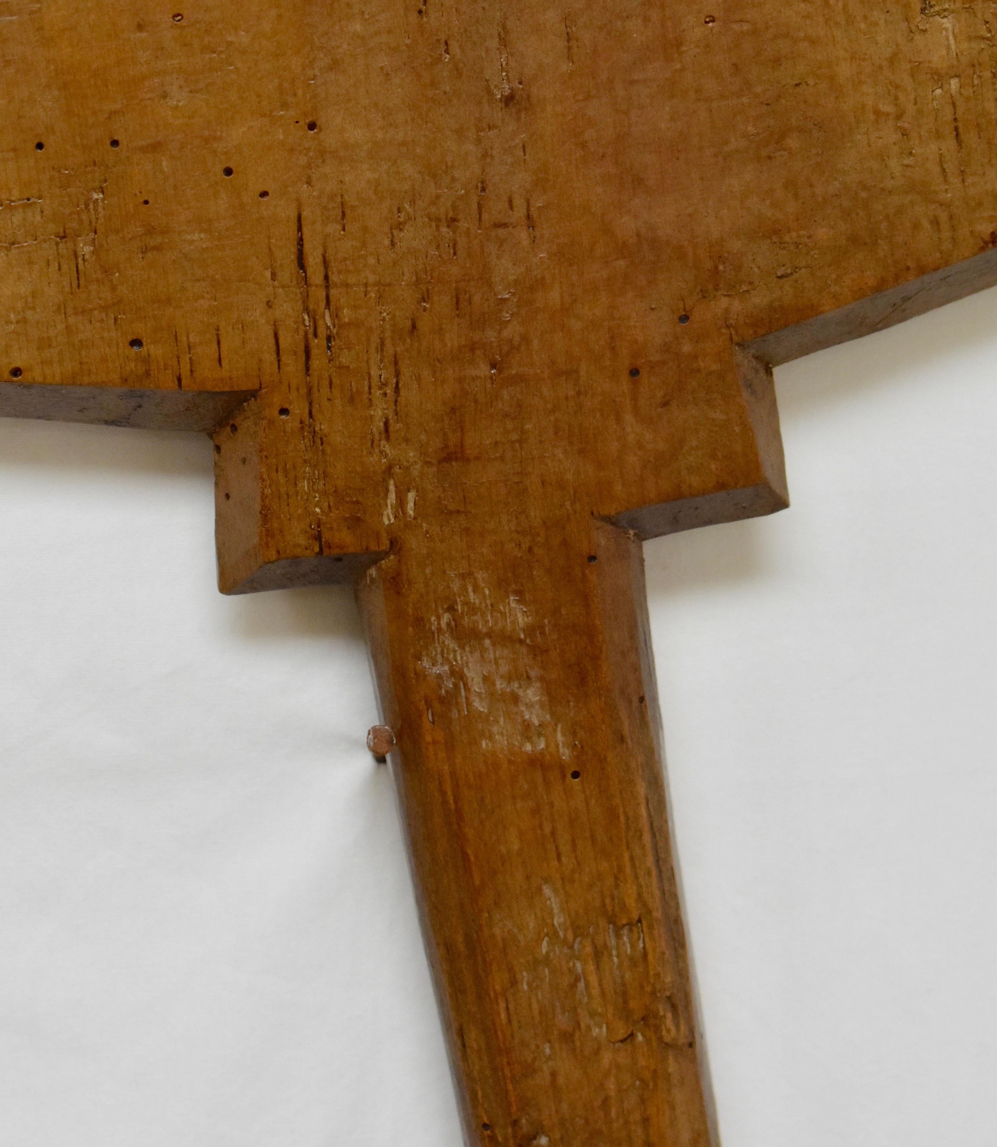 A vintage oak bread peel, hand-carved from a single board. The shaft is worn smooth and the large paddle shows only very slight charring.