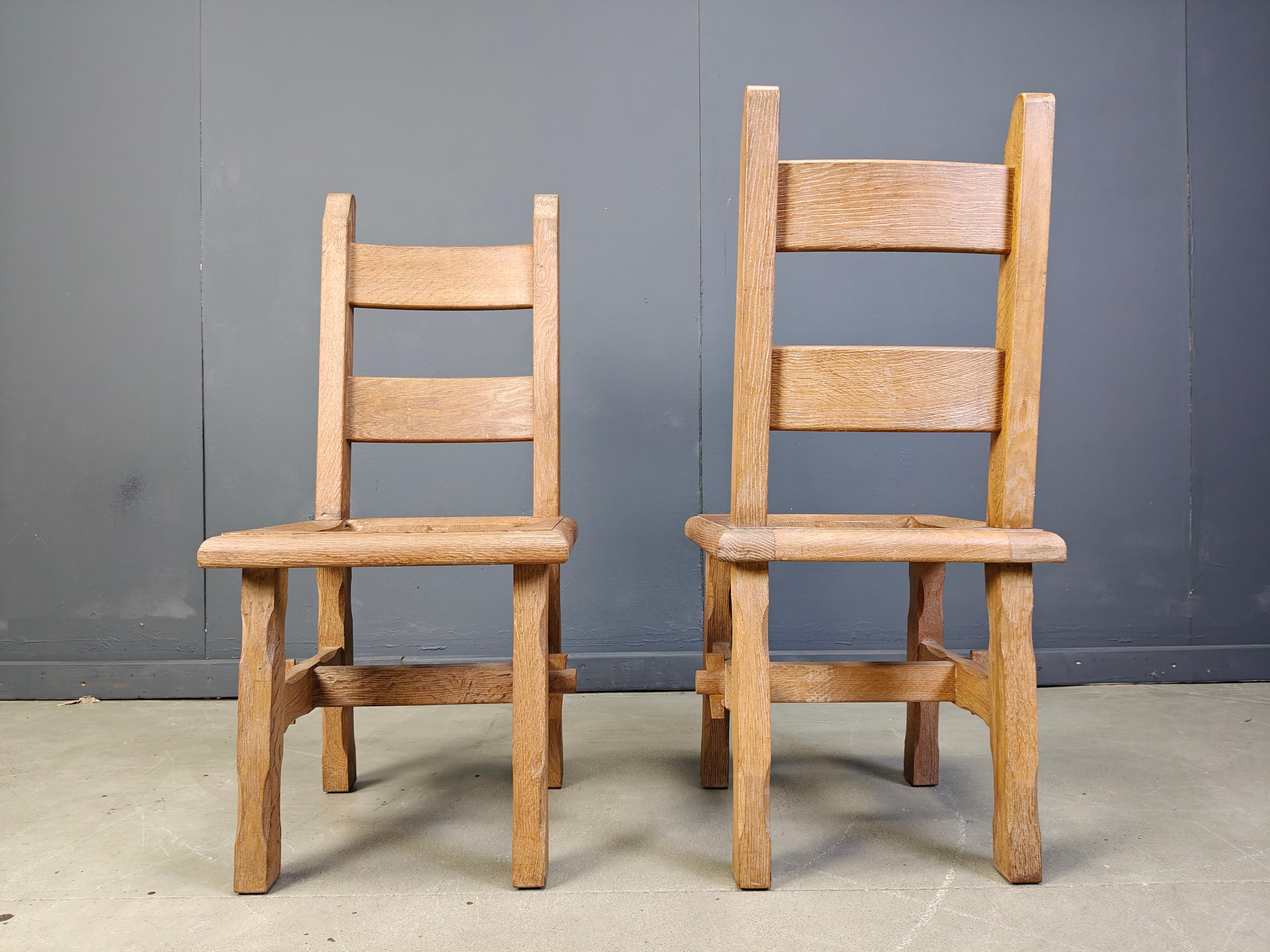 
Very sturdy solid oak dining chairs.

Very sturdy ever lasting frames with an interlocking center piece.

Rustic design.

1960s - Belgium

Good overall condition.

Dimensions:
Height: 105cm
Width: 45cm
Depth: 50cm
Seat height: 47cm

Ref.: