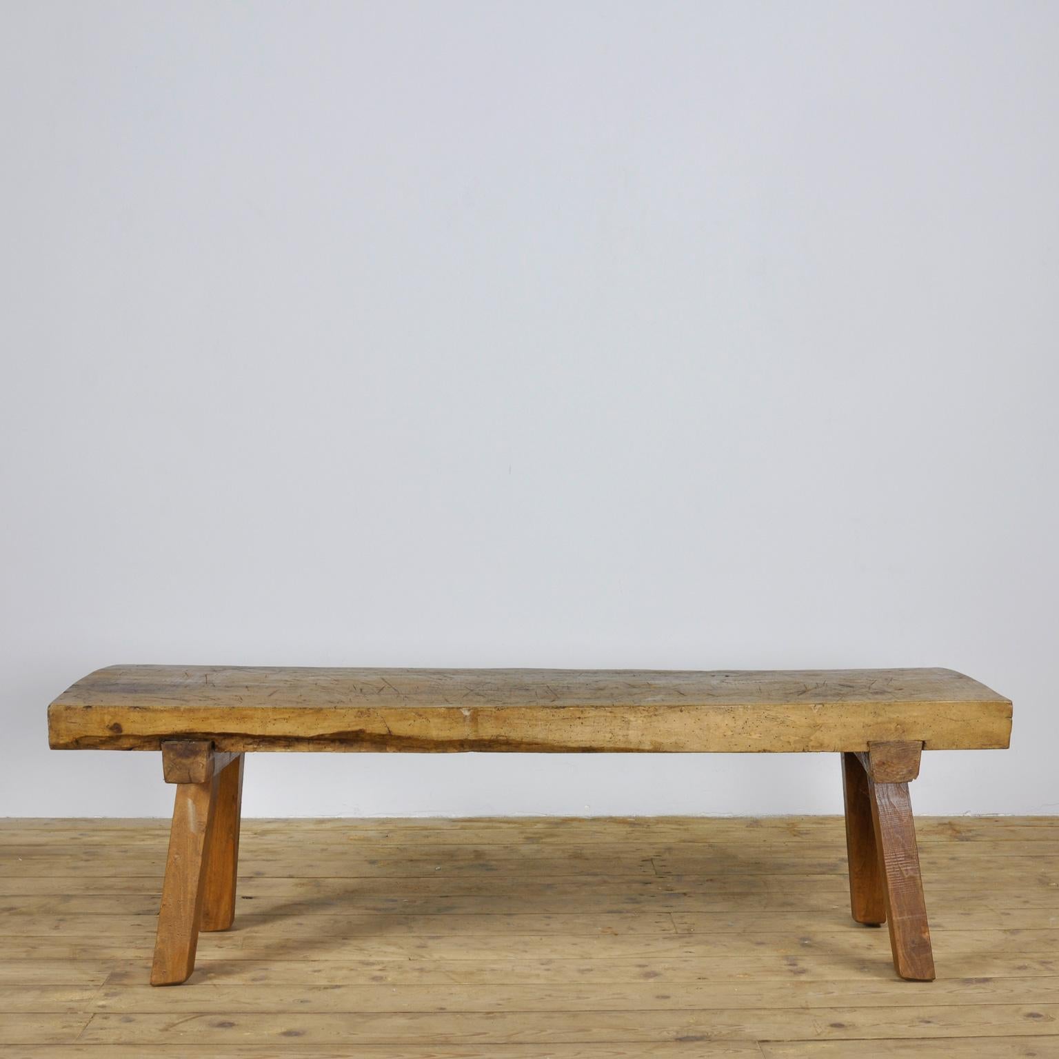 This oak butcher's block was produced in Hungary, circa 1930s and has a 9 cm thick top. The legs has been cut down to a standard coffee table or bench size.