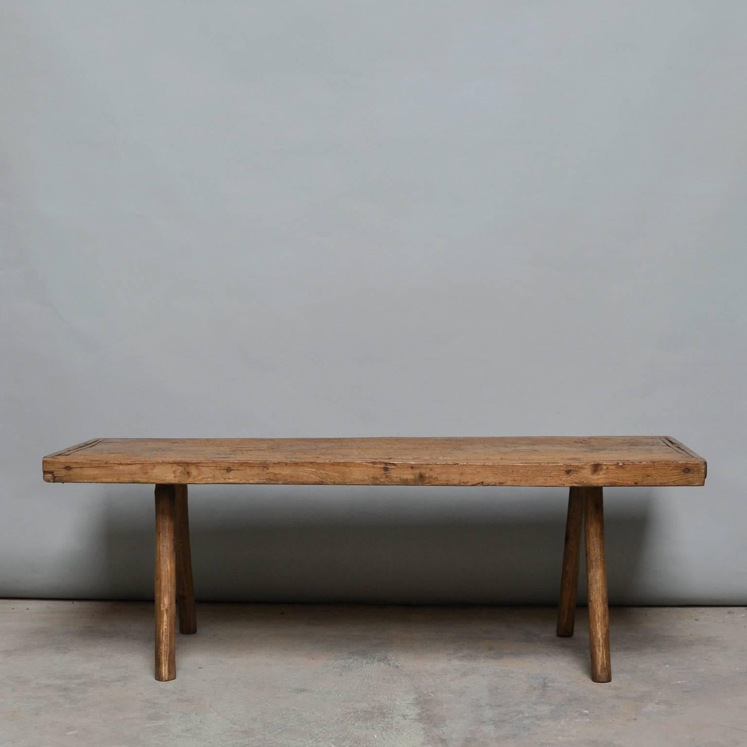 This oak butcher's block was produced in Hungary, circa 1930s. The piece features the original oak legs, and has been wax-finished. The legs has been cut down to a standard coffee table or bench size.
