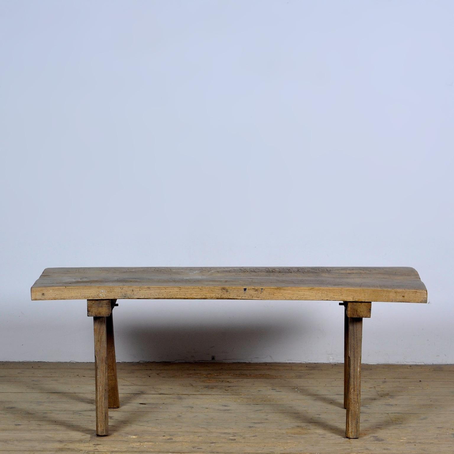This oak butcher's farm table was produced in hungary around the 1920s. With an oak top of 5 cm thick. The legs are shortened to the ideal height for a coffee table or bench. Treated for woodworm. 