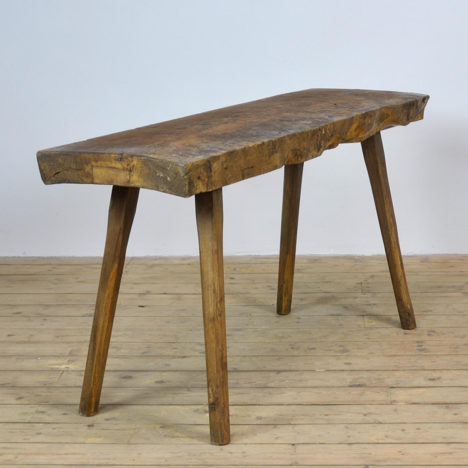 This oak butcher's farm table was produced in Hungary circa 1930s. With a nice distressed oak top of 10 cm thick. This piece has been wax-finished. Treated for woodworm.