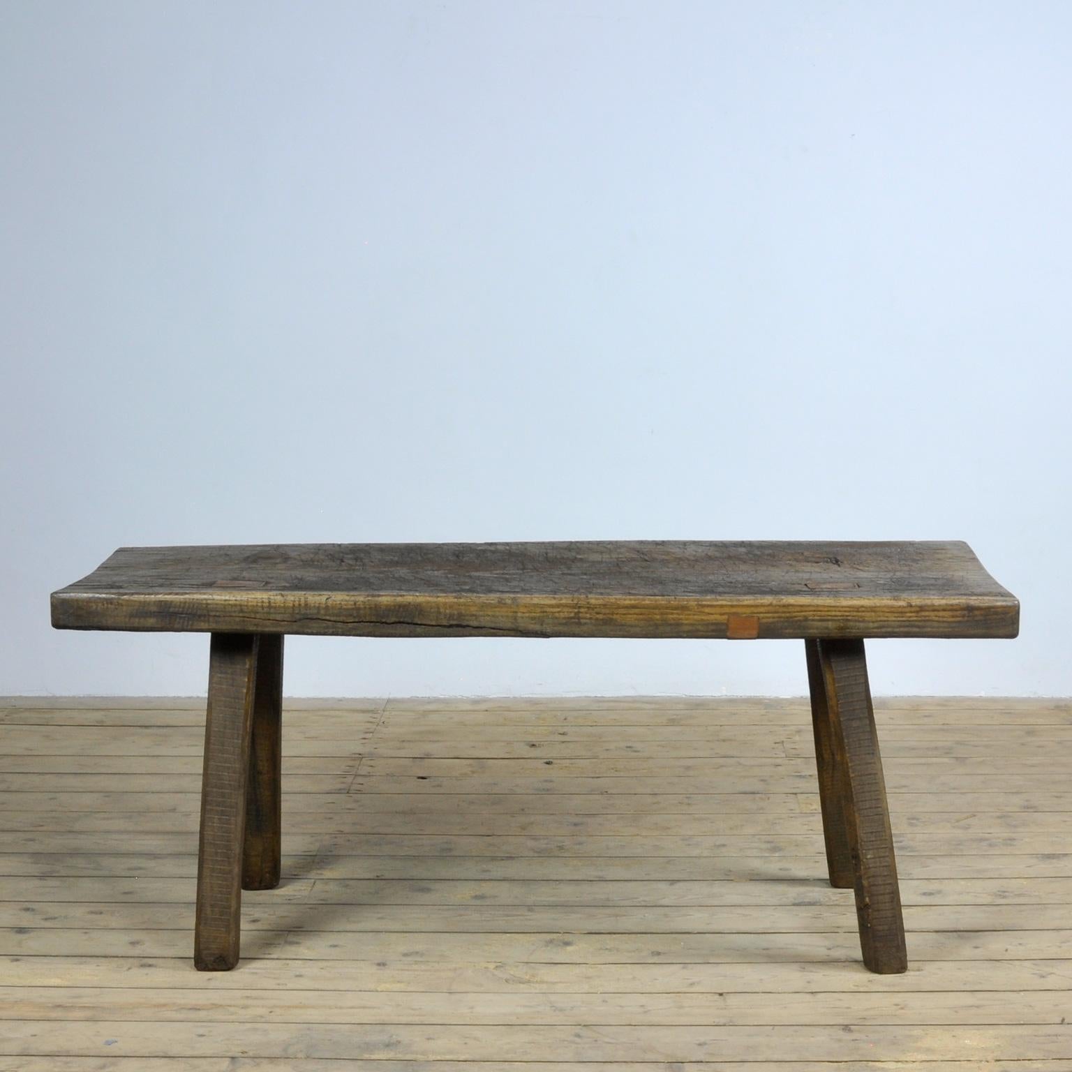 This oak butcher's farm table was produced in Hungary circa 1930s. With a nice distressed oak top of 8 cm thick. This piece has been wax-finished. Treated for woodworm.