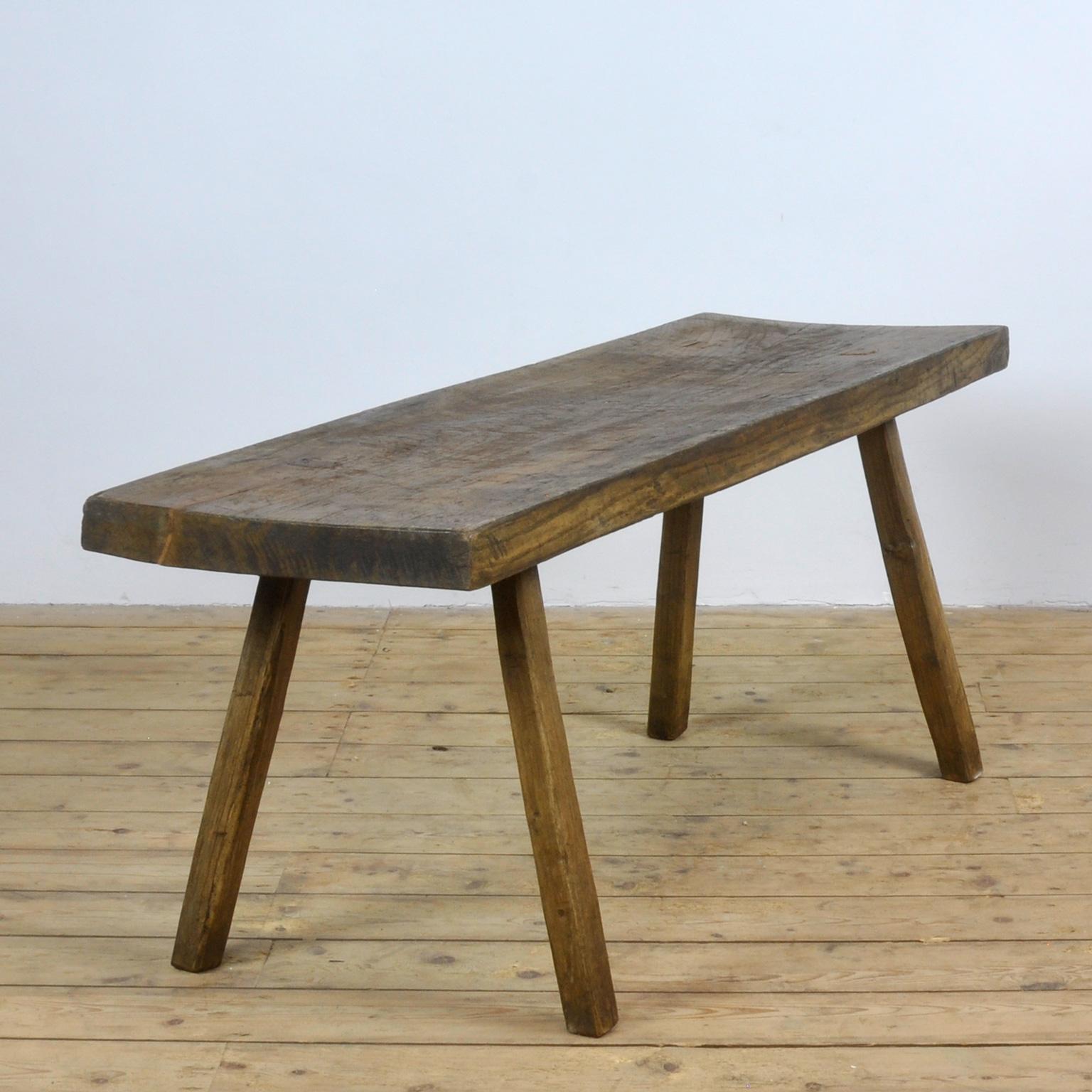 This oak butcher's farm table was produced in Hungary around the 1930s. With a nice distressed oak top of 7 cm thick. This piece has been wax-finished. Treated for woodworm.