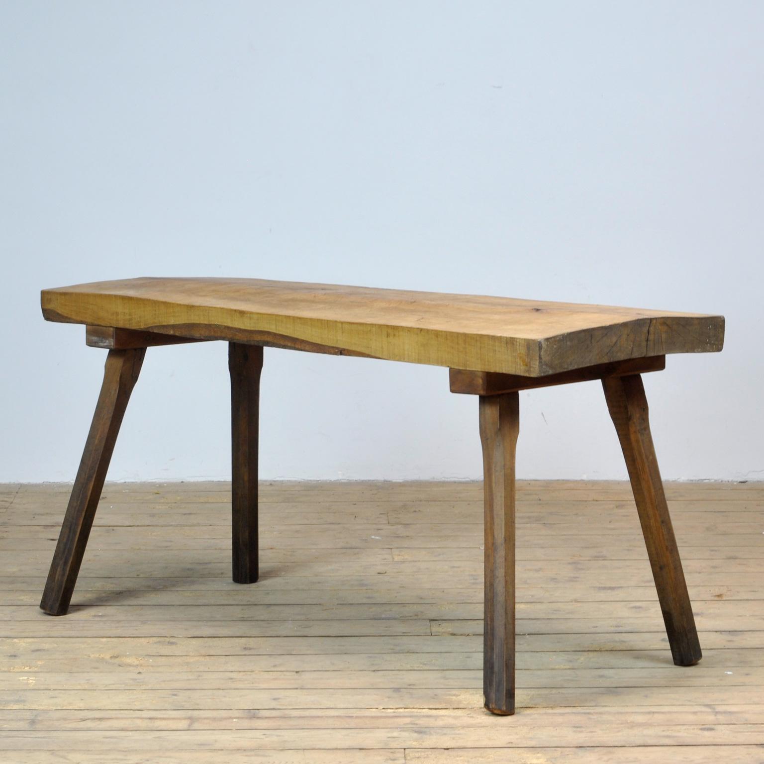 This oak butcher's farm table was produced in Hungary, circa 1960s. With a nice distressed oak top of 7.5 cm thick. This piece has been wax-finished. Treated for woodworm.