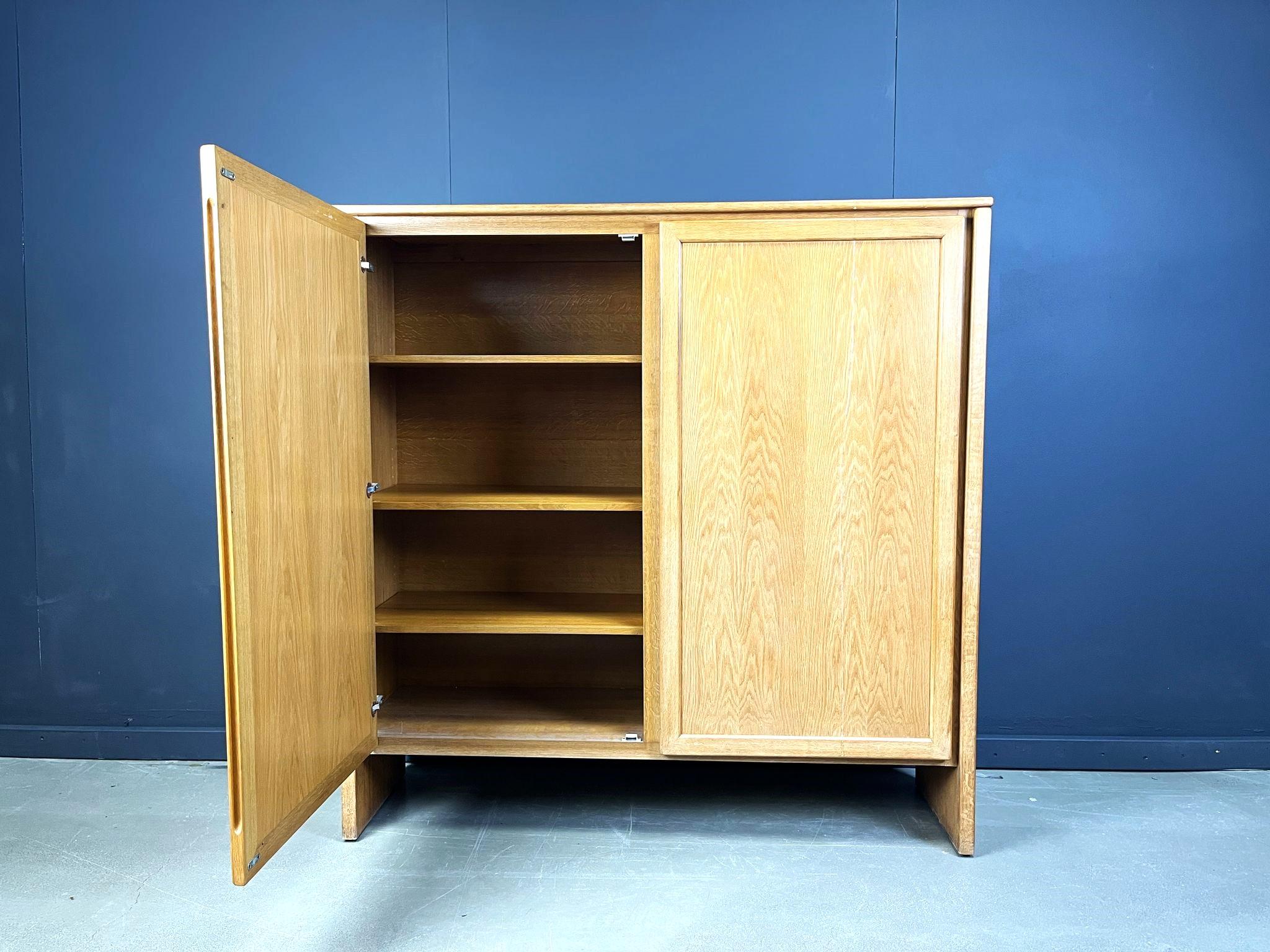 Timeless clear oak 2 door cabinet offering plenty of storage space.

Very well crafted piece with integrated carved out handles.

High quality piece crafted in Belgium.

1970s - Belgium

Dimensions:
Height: 150cm
Width: 150cm
Depth: 46cm

Ref.: