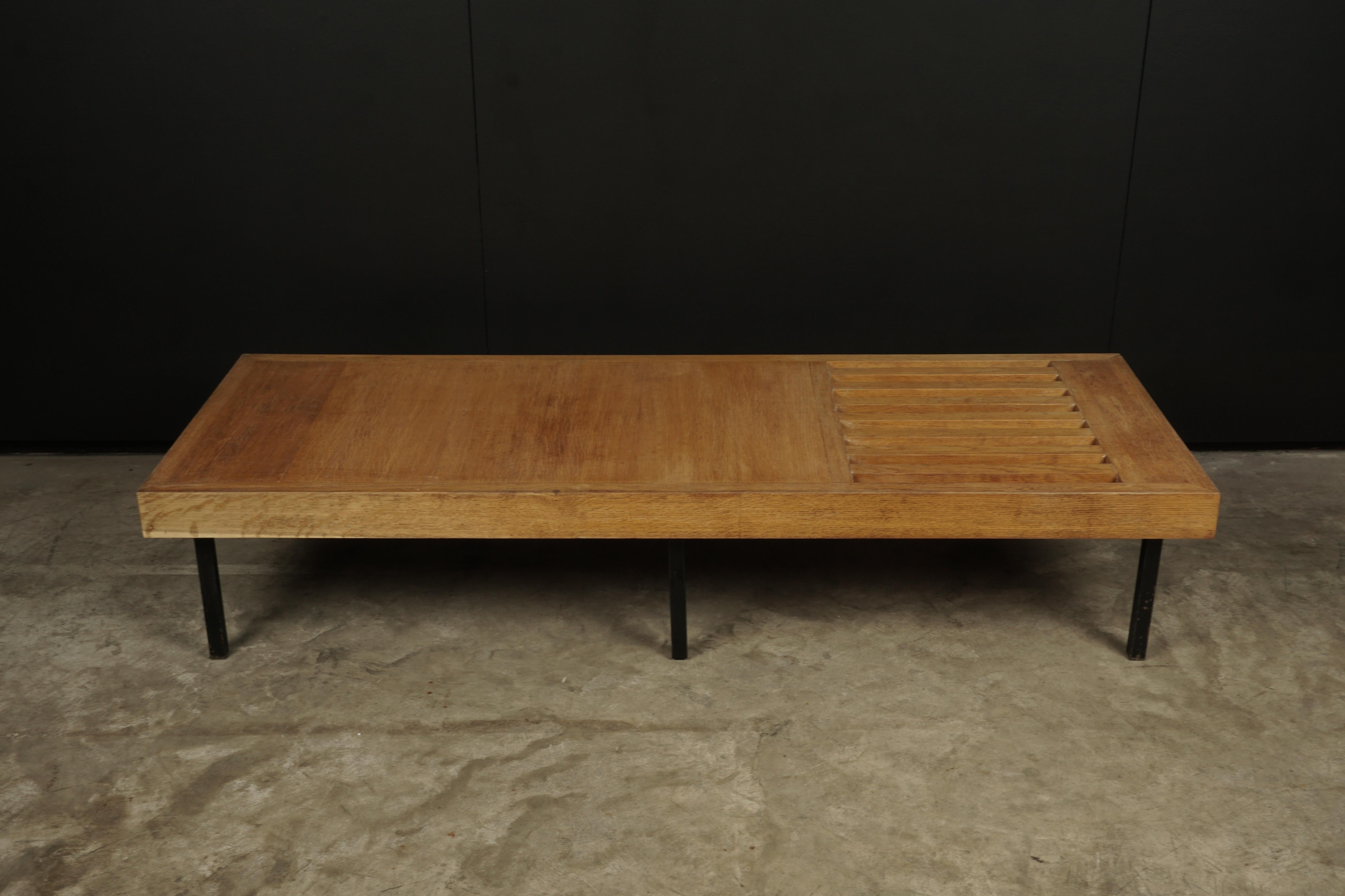 Vintage oak coffee table from France, 1960s. Rare slatted model with metal feet. Light wear and patina.