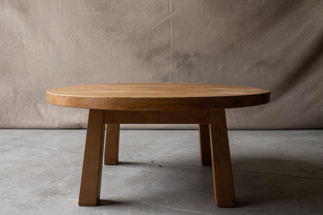 Vintage circular oak coffee table from France, circa 1960. Solid light oak construction with four squared legs. Light wear and use.
