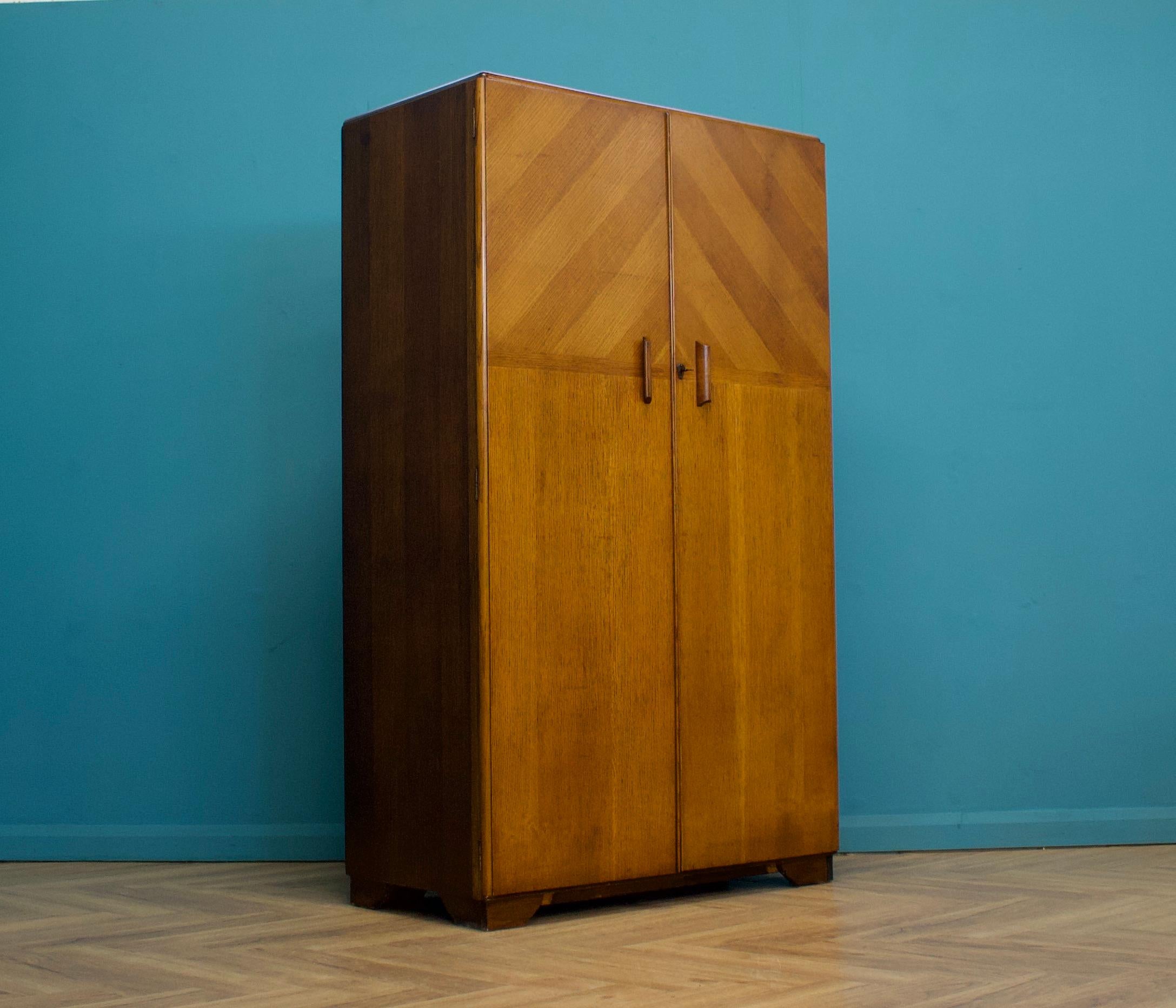 A vintage oak Art Deco compactum / compact wardrobe from Fitrobe, circa 1930's
Inside is beautifully fitted out with a clothes and shoe rail, shelves, drawers and a compartment