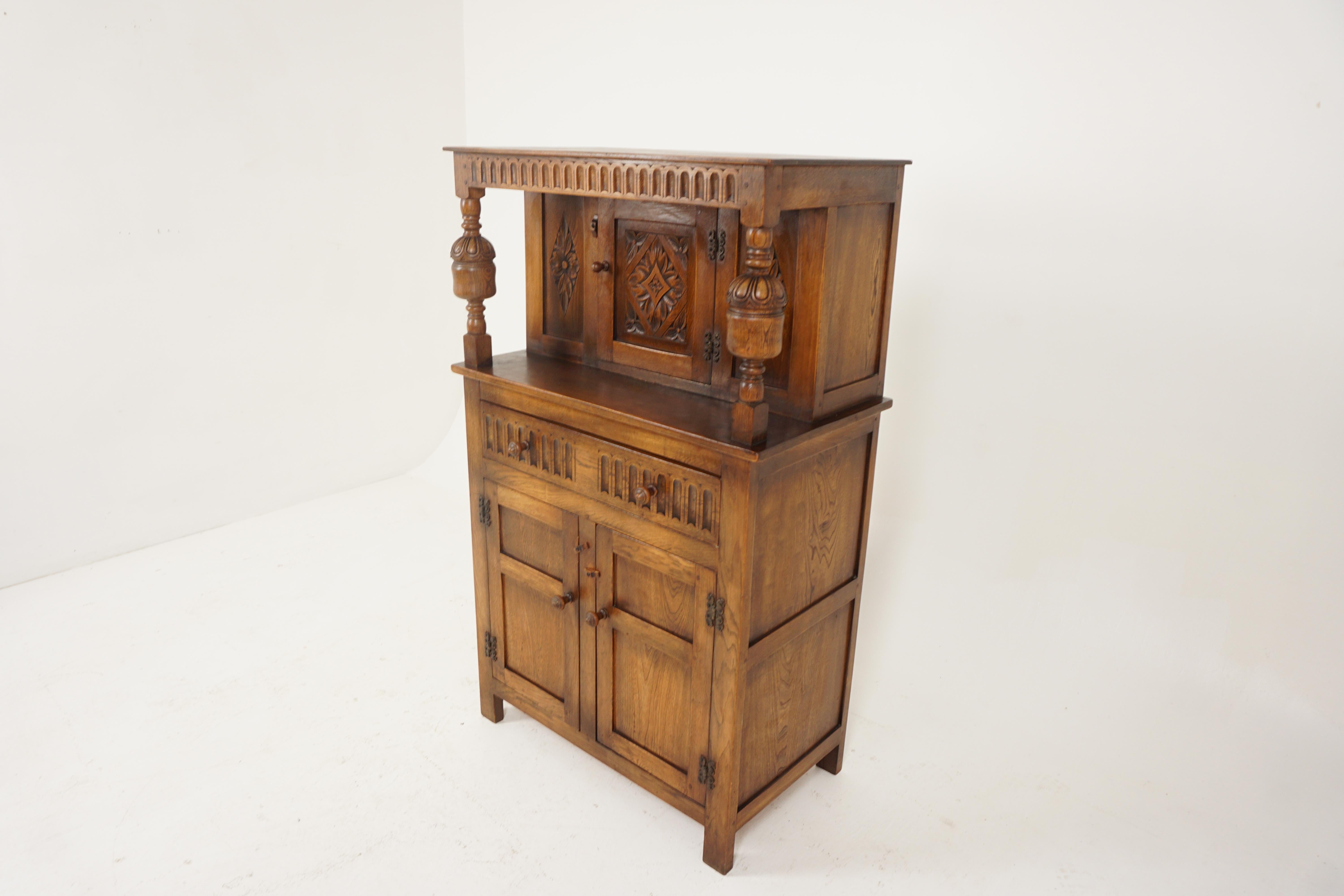 Vintage oak court cupboard, sideboard, buffet + hutch, Scotland 1930, B2670

Scotland 1930
Solid oak
Original finish
Rectangular top
Carved frieze underneath
Carved central door
Opens to reveal storage space
Base has long drawers with