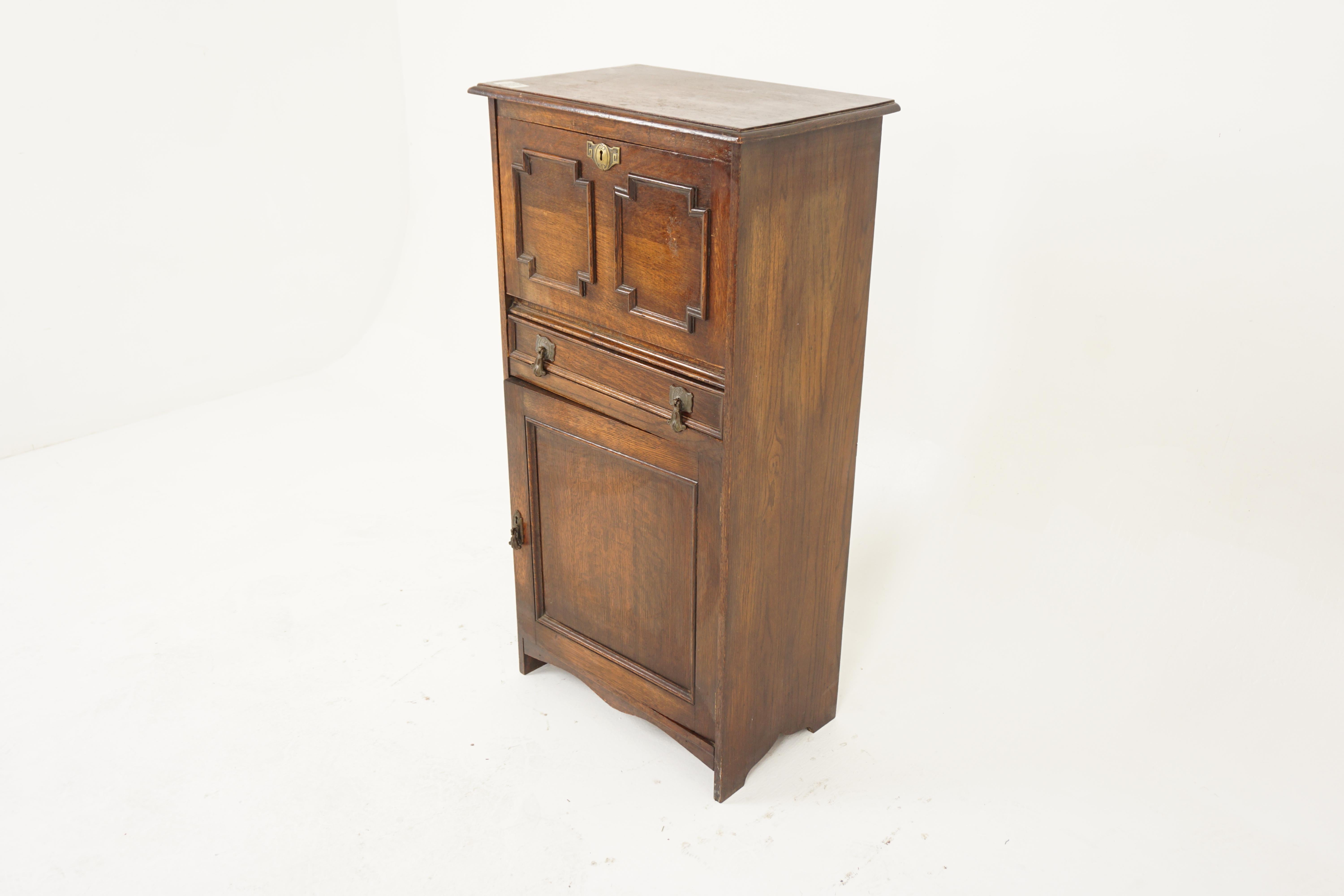 Vintage Oak Desk, Writing Table, Cabinet, Scotland 1925, H993

Scotland 1925
Solid Oak
Original Finish
Rectangular moulded top
Panelled drop front door opens to reveal writing surface with open cupboards
Single dovetailed drawer below with original
