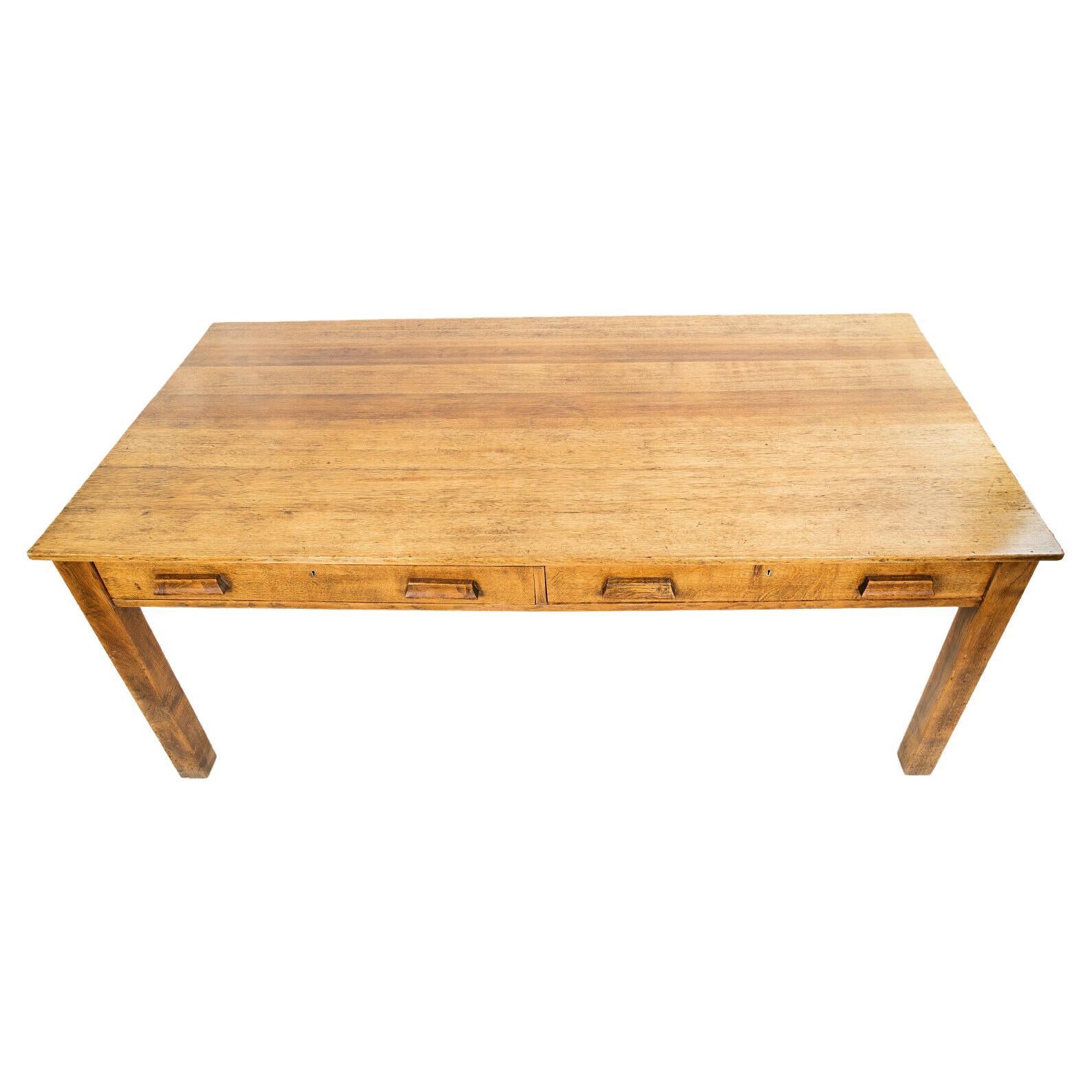 Large Farmhouse table

A large impressive kitchen prep centre table from the early 20th century. 

Sold oak with square legs, with twin drawers below a plank top.

Dimensions (cm): 

76H x 183W x 90D

Condition:

Showing wonderful