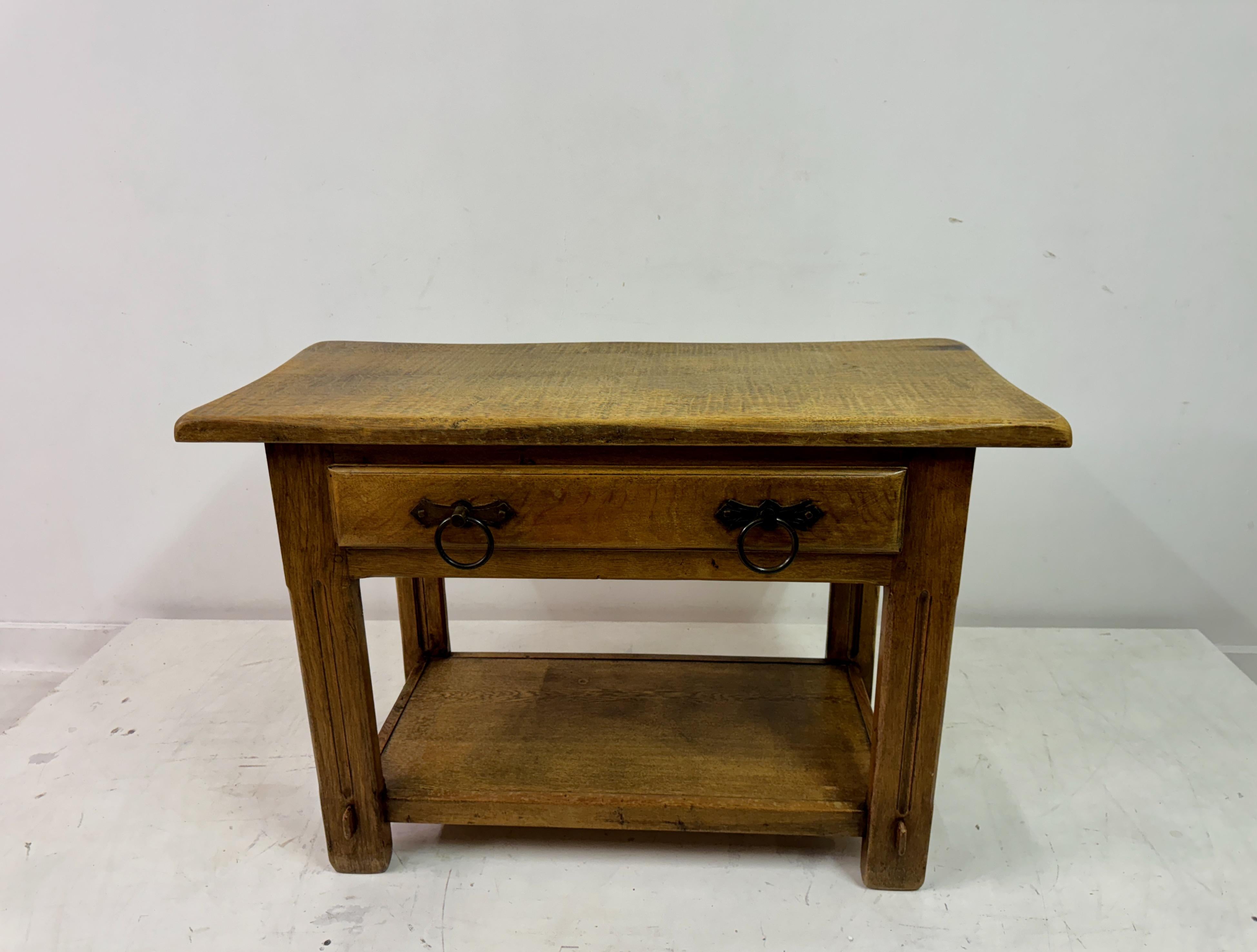 Vintage Oak Console Table

This vintage oak console table combines timeless design with sturdy craftsmanship, making it both practical and decorative. The table features a rectangular top with softly beveled edges, showcasing the rich grain and warm