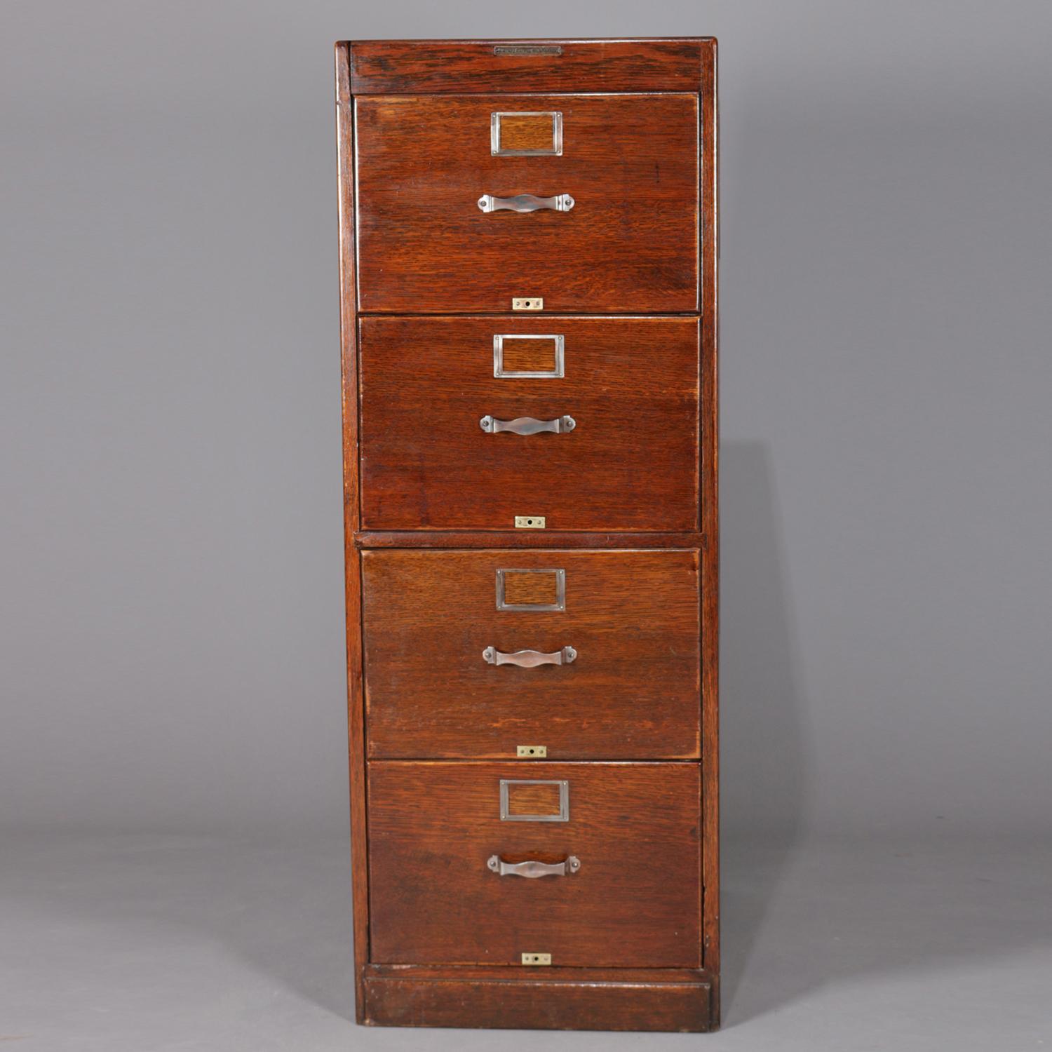 Vintage oak file cabinet by Library Bureau sole makers features panelled sides and four drawers, original maker label, circa 1910

Measures: 51.5