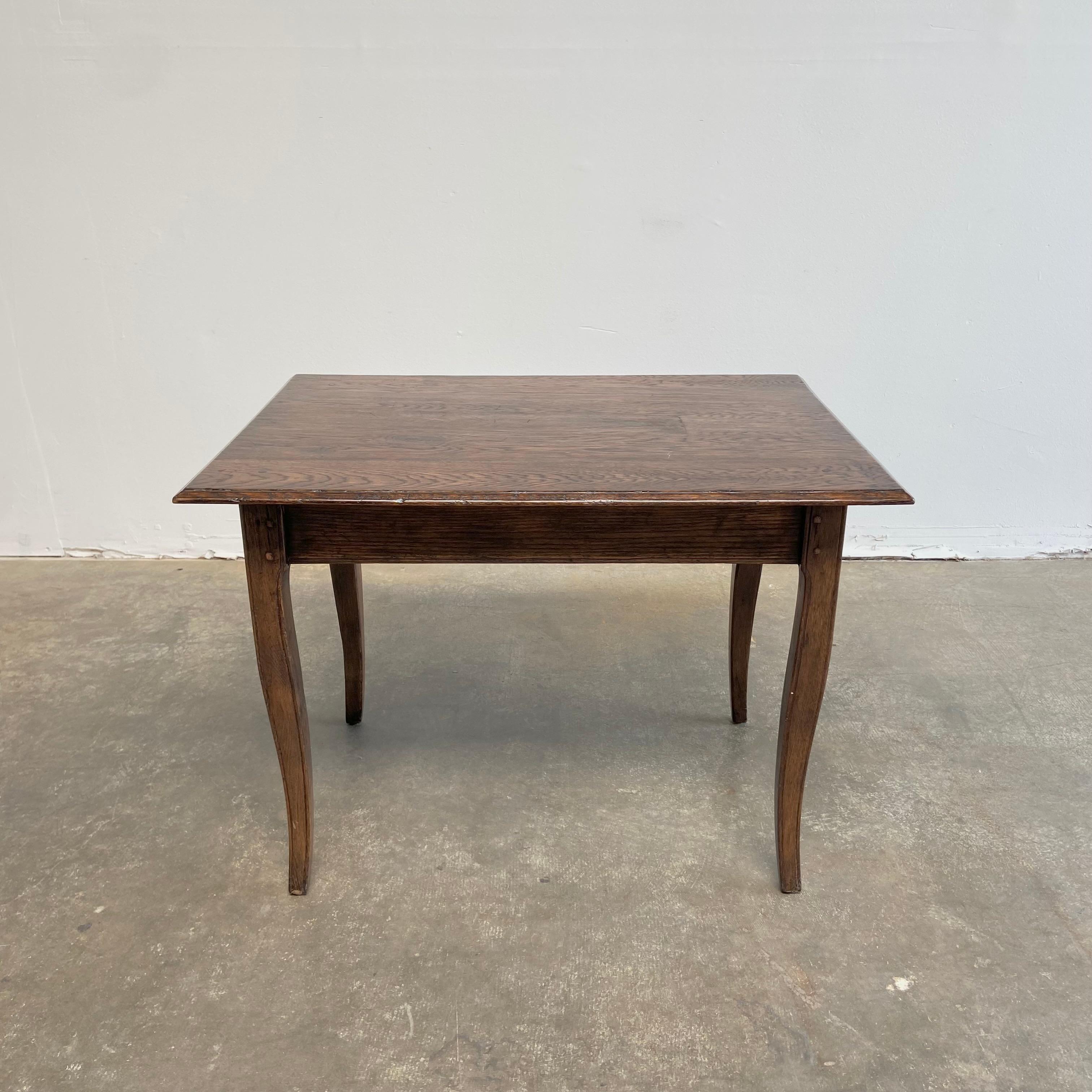 Vintage oak table 
Sturdy ready for everyday use. This lamp table has some subtle imperfections on the top.
Legs are solid, can be used as is, or bleached.
Measures: 36” W x 26” D x 26” H
Clearance: 21” H.