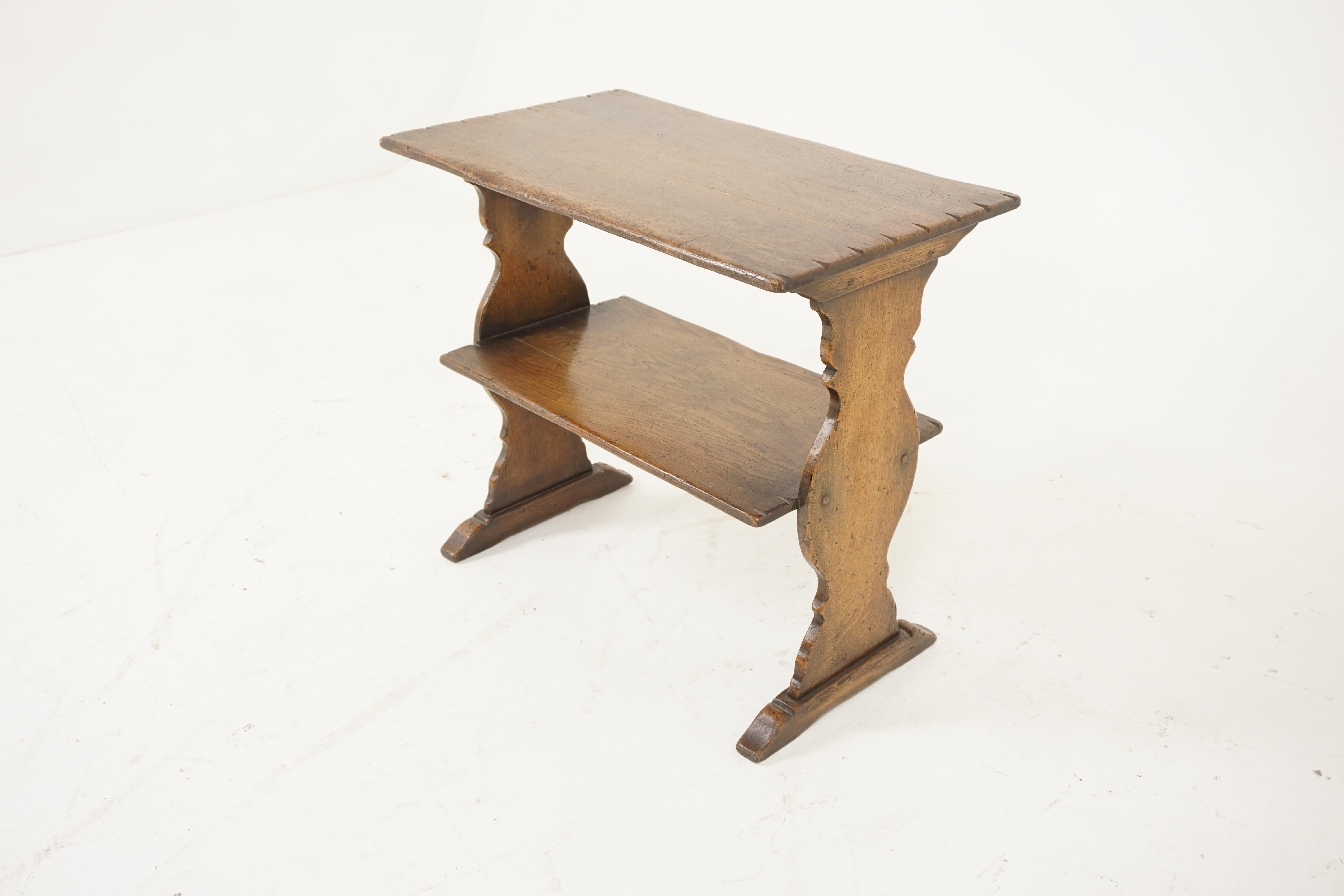 Vintage oak table, two-tiered bookstand, antique furniture, Scotland, 1930

Scotland, 1930Solid oak
Original finish
Rectangular top with cut outs on the ends
Second shelf underneath
Shaped supports on the ends
All standing on a pair of shaped