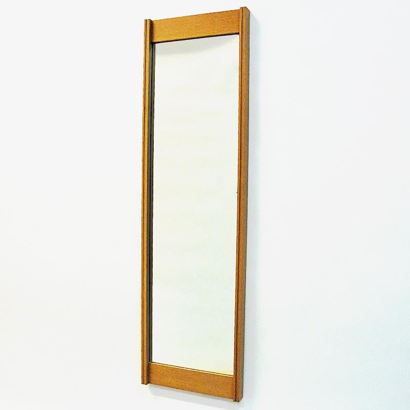 Rectangular, slim and lovely oak wall mirror produced by Aktuell Form AB, Lidingö, Sweden, 1960s. Perfect matched edges. Good vintage condition and labeled on the back with art nr: 1122 and manufacturers name.
Measures: 115 cm H x 33cm W x 4 cm