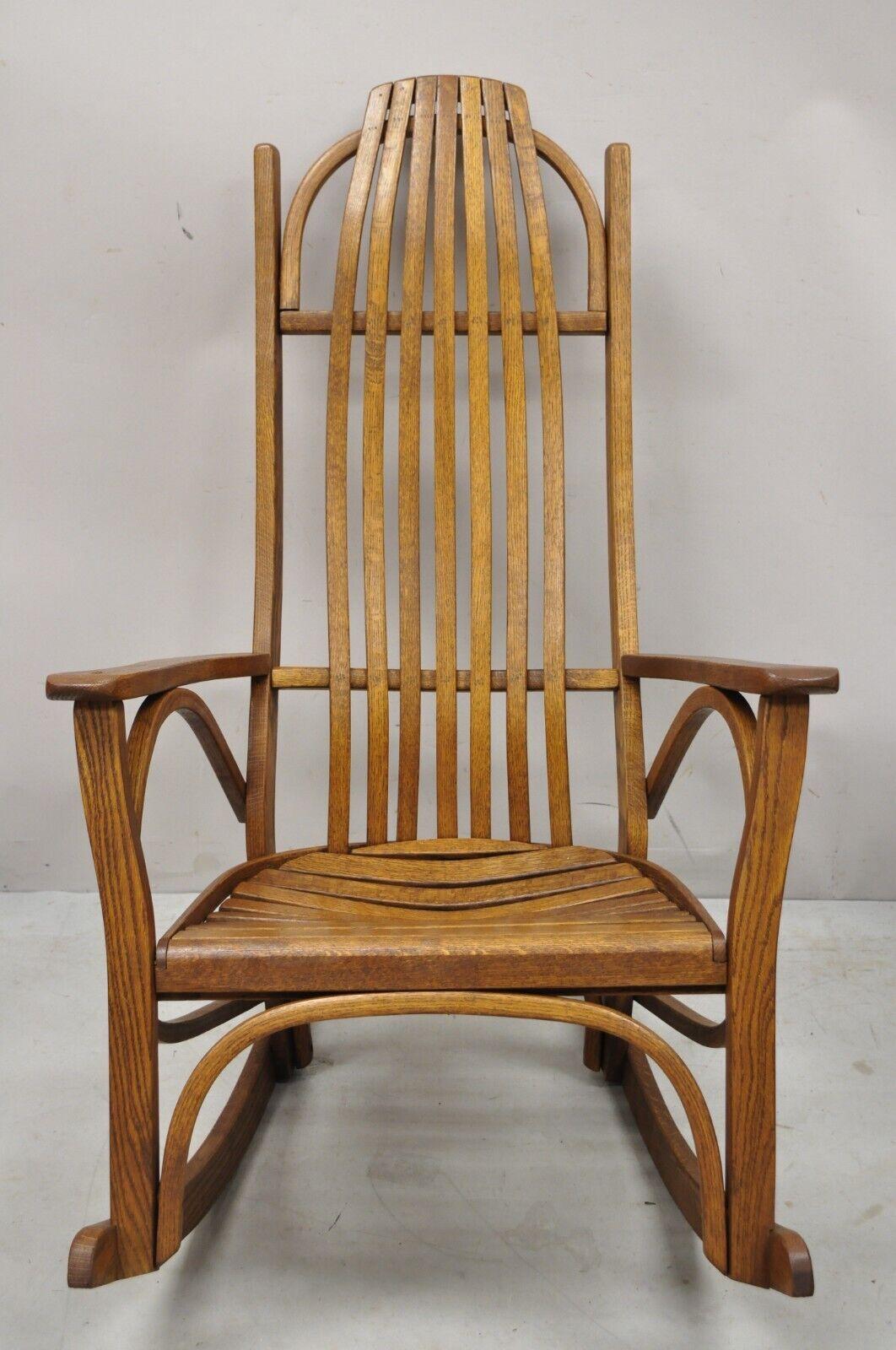 Vintage Oak Wood Adirondack Arts & Crafts Rocker Rocking Chair. Item features solid wood construction, beautiful wood grain, very nice vintage item, quality American craftsmanship, great style and form. Circa Mid 20th Century. Measurements: 42