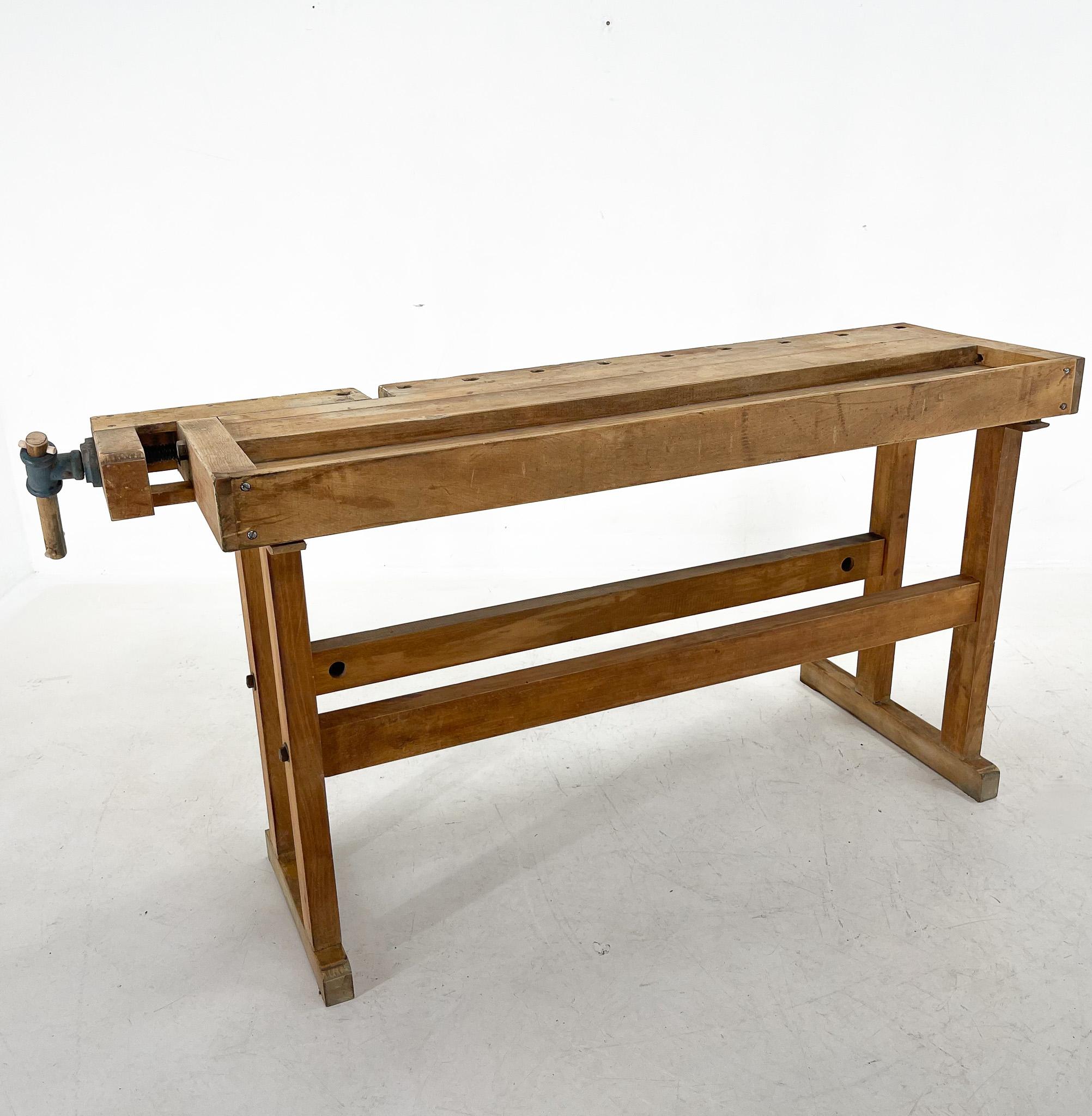 Carpenters workbench, two built-in wooden vices screws. Produced in former Czechoslovakia in 1950's by Hikor Pisek. Can be used as a side table, sideboard, serving table or console. All parts are original, only two pegs in the vise have been