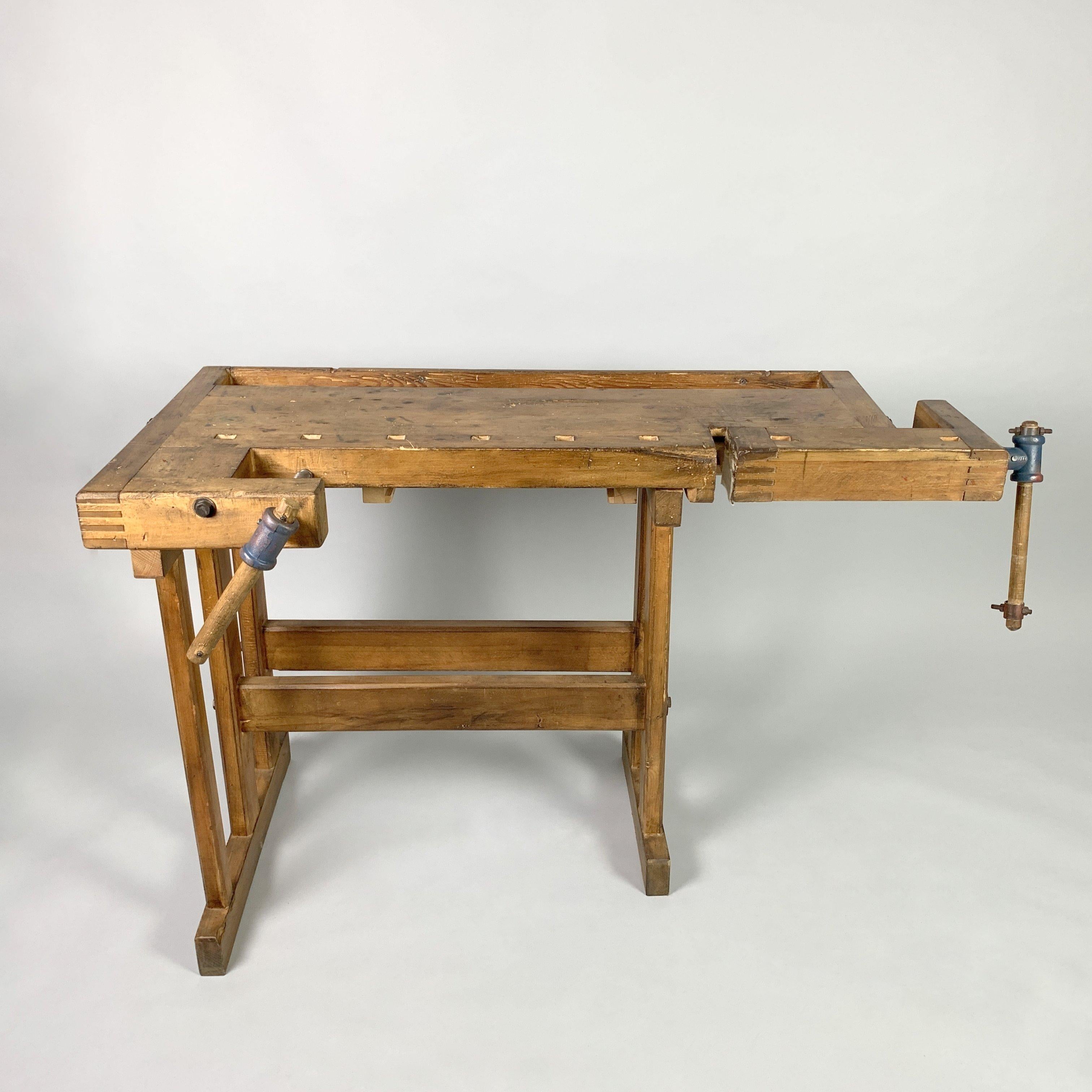 Carpenters workbench, two built-in wooden vices screws. Produced in former Czechoslovakia in 1950s by Hikor Pisek as labelled (see photo). Can be used as a side table, sideboard, serving table or console. Cleaned and oiled.