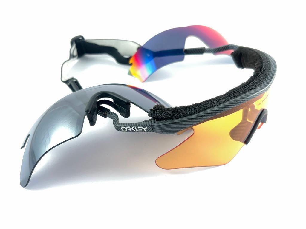 
Vintage Oakley Sports Sunglasses With Two Sets Of Lenses Sunglasses. 
This Item Show Minor Sign Of Wear Due To Storage On The Inside Of The Front Strap Not Noticeable While Wearing.

Made In Usa.

