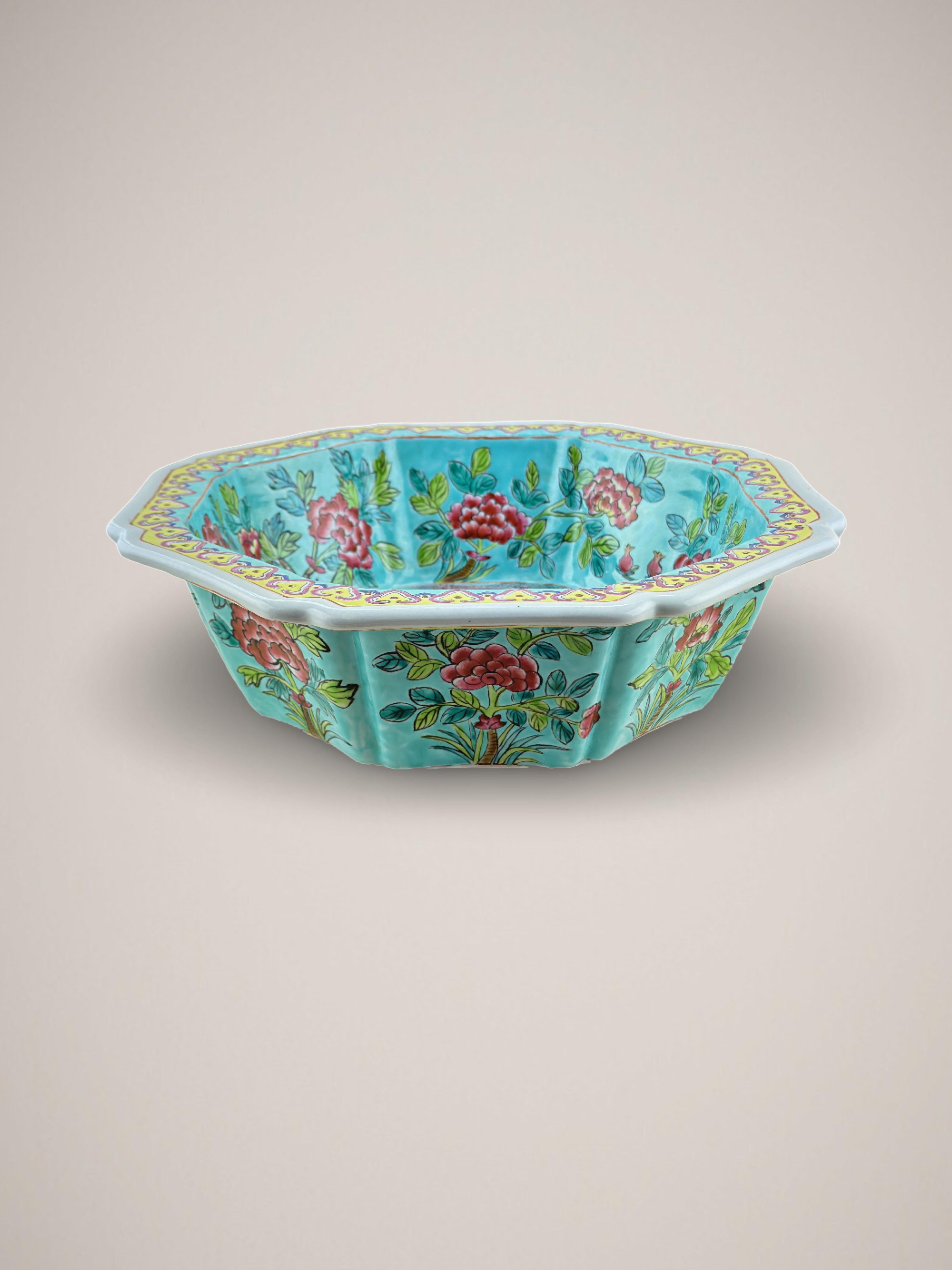 A colourful 'Straits style' ceremonial bowl. Made in China in the 1960s

Decorated in the Straits/Peranakan style, this eye-catching bowl is a wonderful representation of the highly sought after style.  An array of hues: turquoise, pink, yellow,