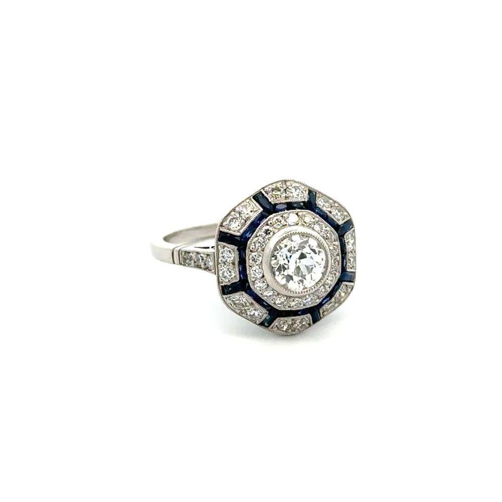 Simply Beautiful! OEC Diamond, Blue Sapphires and OEC Diamond Platinum Cocktail Ring. Centering a securely nestled Hand set .76 Carat Old European Cut Diamond. Complimented by Sapphires, weighing approx. 0.90tcw and Old European Cut Diamonds,