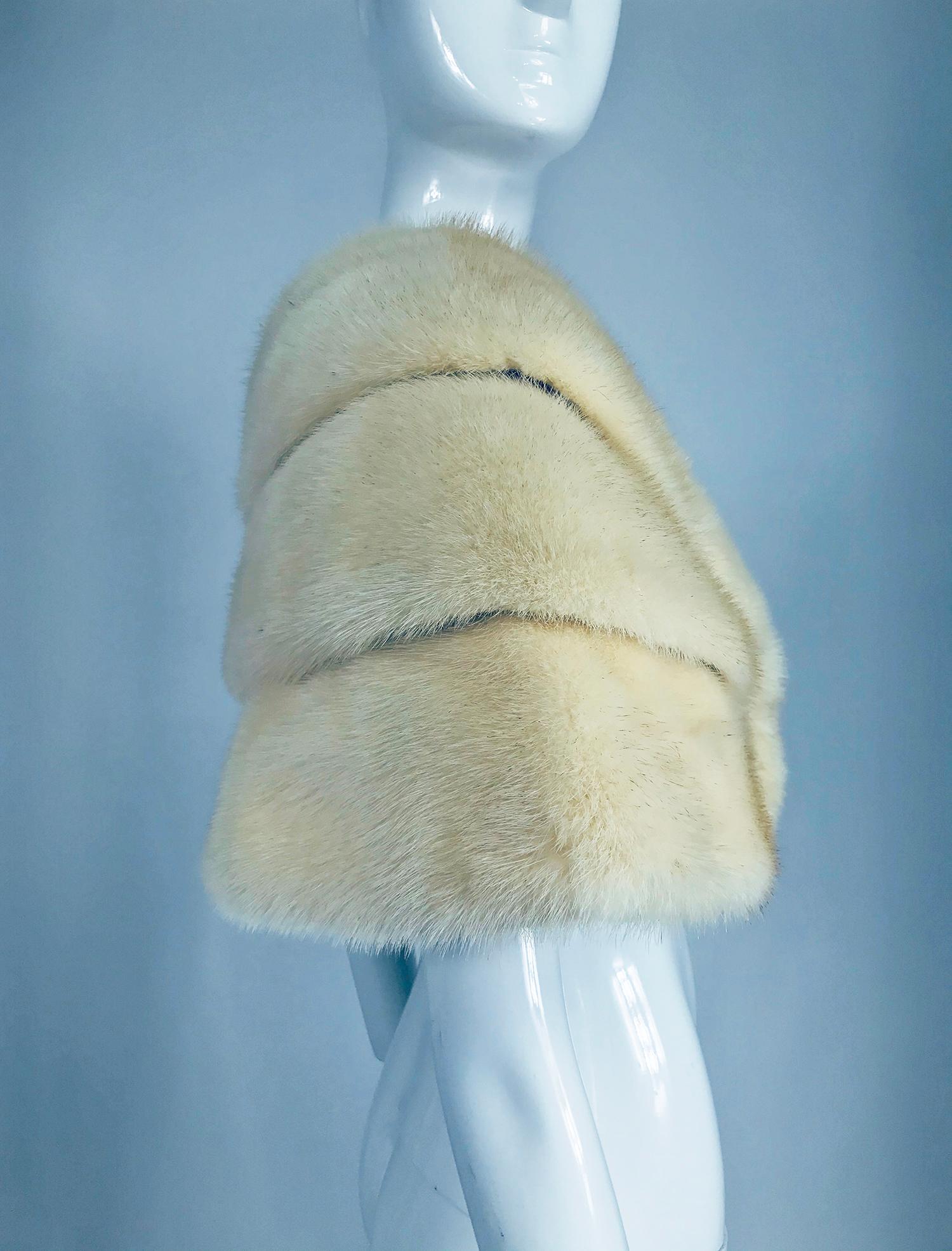 Vintage off white mink stole Jordan Marsh from the 1950s. Creamy triple layer mink closes at the front, left tab goes through a button hole. Lined in cream silk. Monogrammed inside,Helen G. Looks like it was relined. Fits a