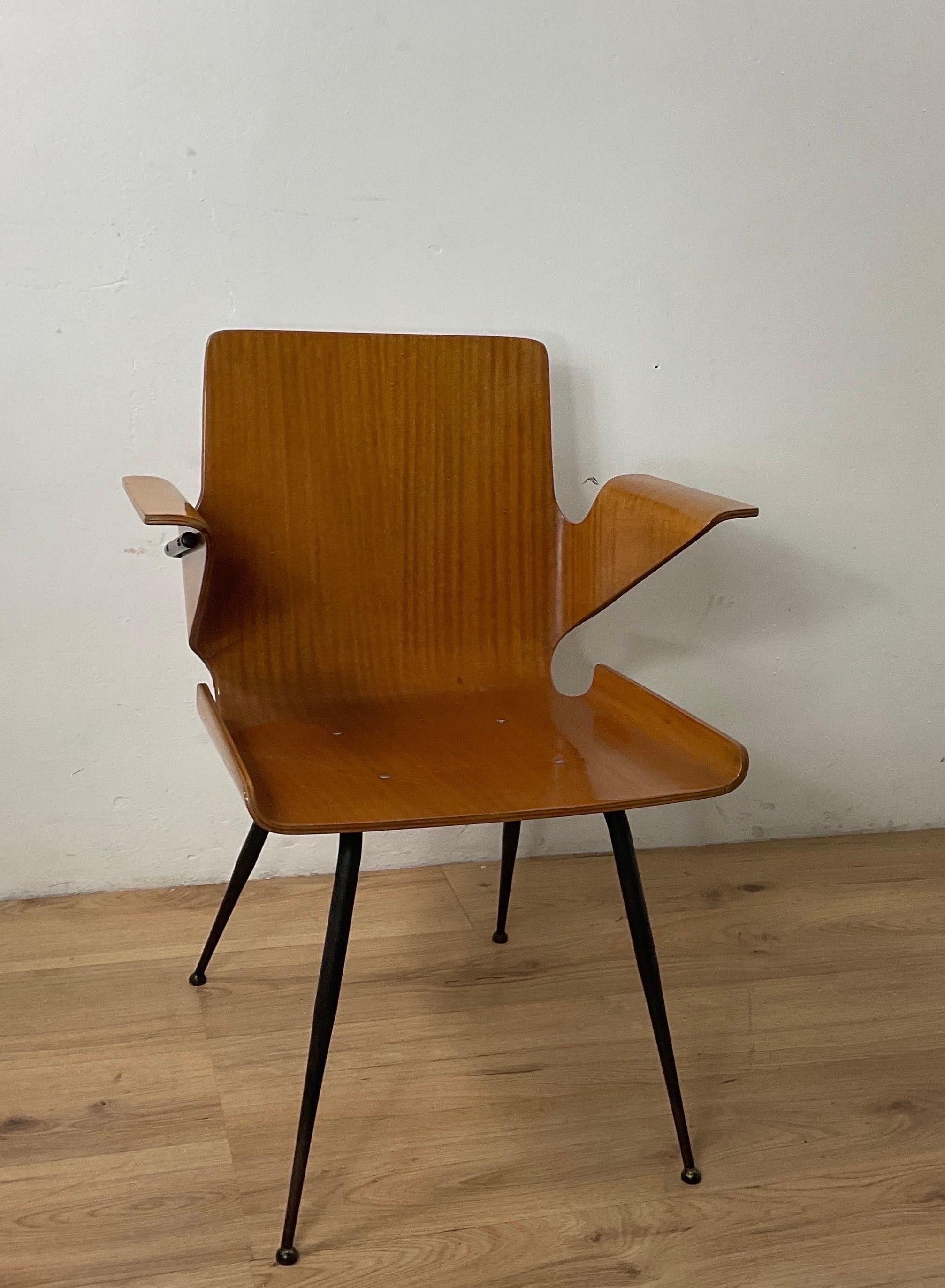 Office chair attributable to Silvio Cavatorta in plywood with a metal frame. Chair in good condition and very rar.