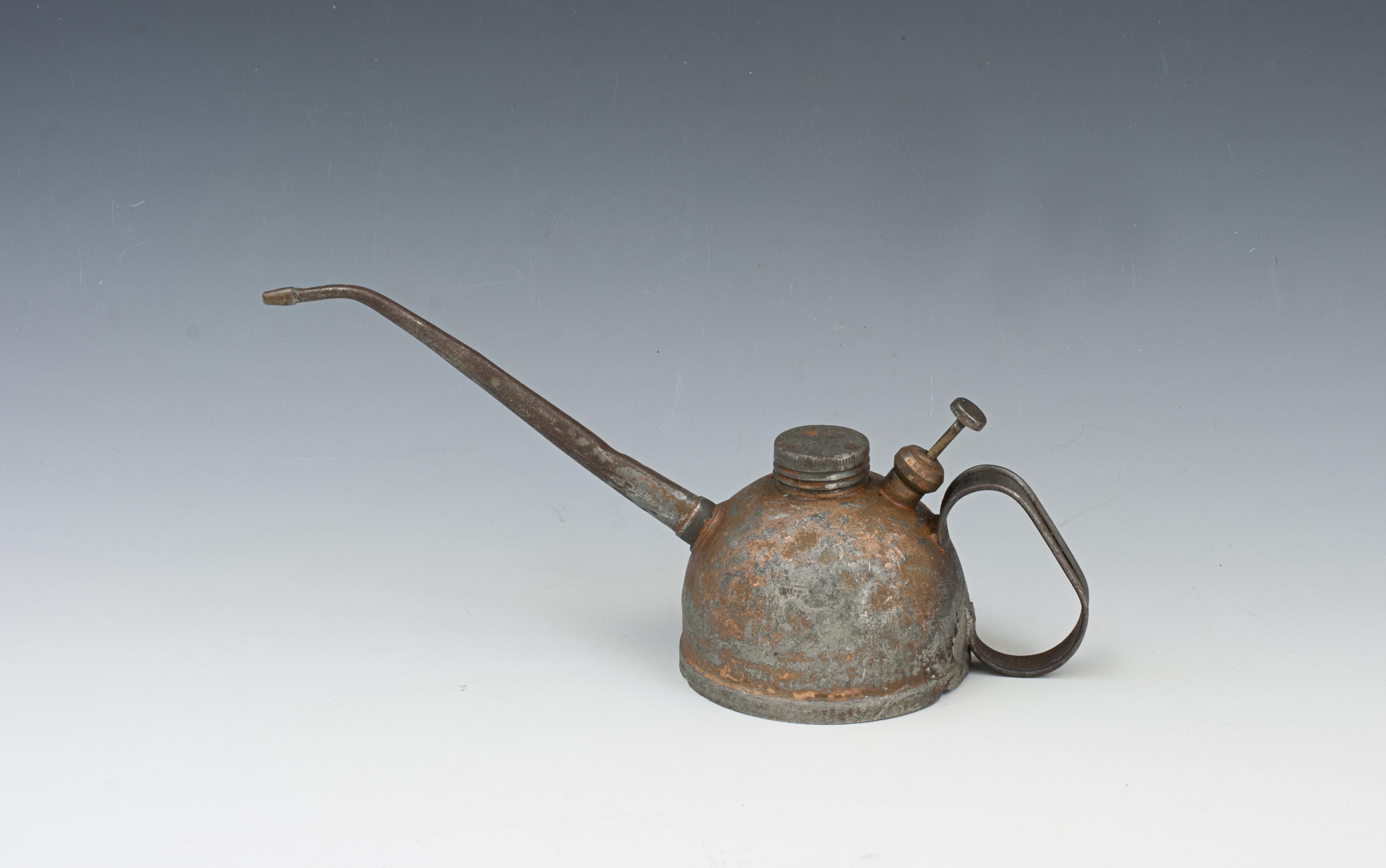 Vintage Copper Force Feed Oil Can.
An automotive tin oil can. A fantastic piece of vintage motoring ephemera, the perfect gift for the motoring enthusiast. Who would have thought the mundane garage oiler of the Golden Age of automobiles would be a