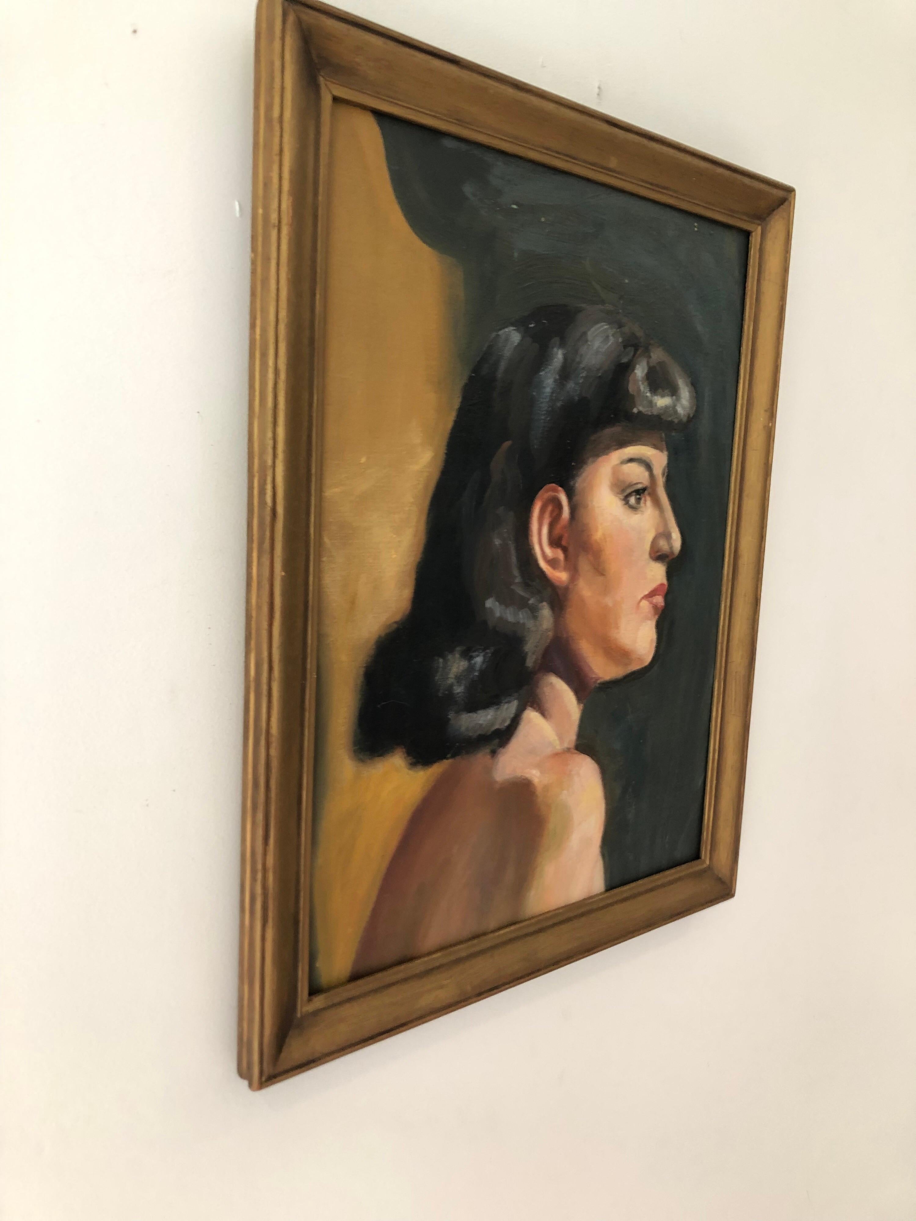 A vintage oil of board portrait of a woman with black hair. In original giltwood frame.
Measures: Sight 12.5