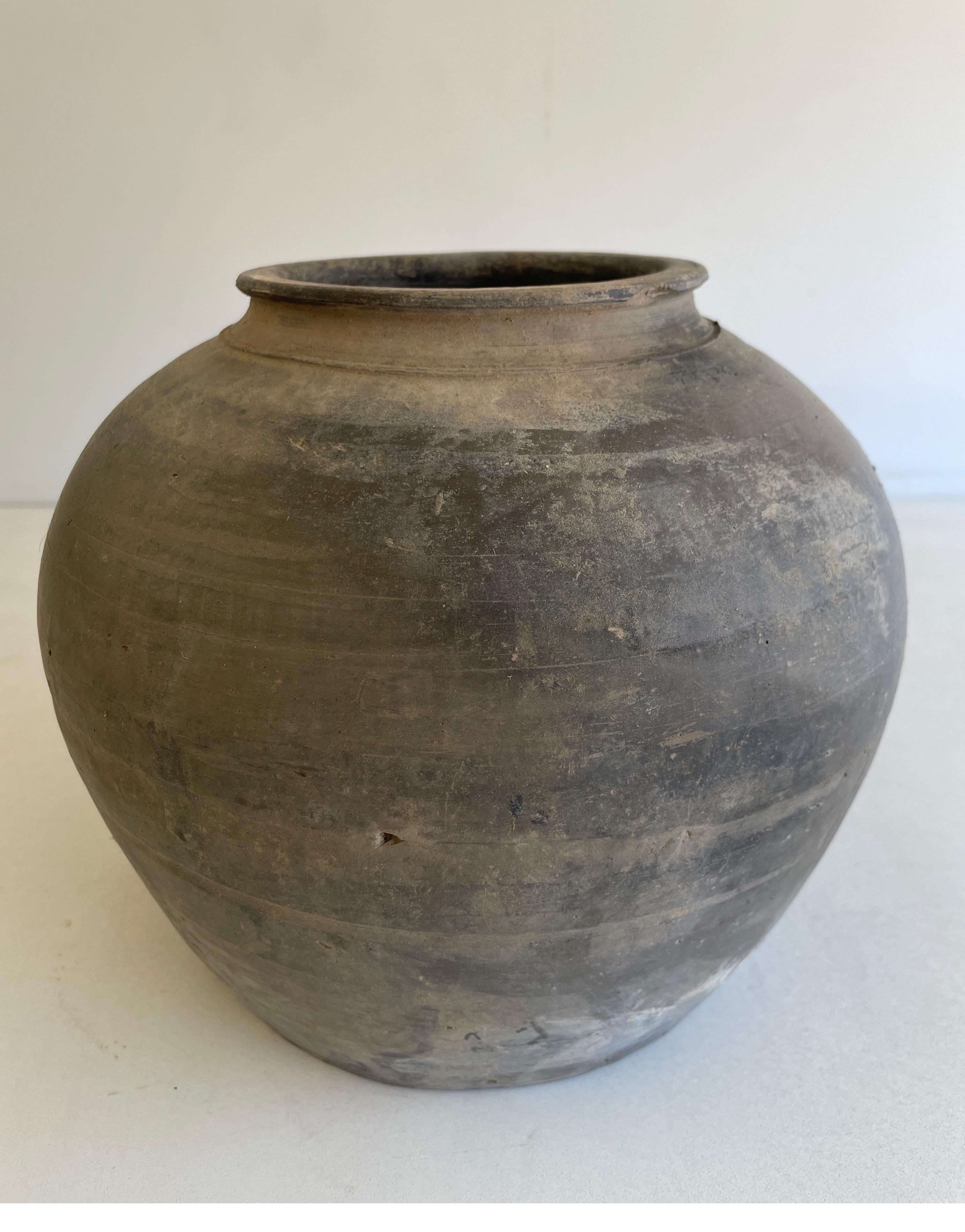 Vintage pottery beautiful and rich in character, this vintage oil pot adds just the right amount of texture + warmth where you need it. Stunning faded black/ brown unglazed finish with warm terra-cotta accents. Some have a more faded appearance than