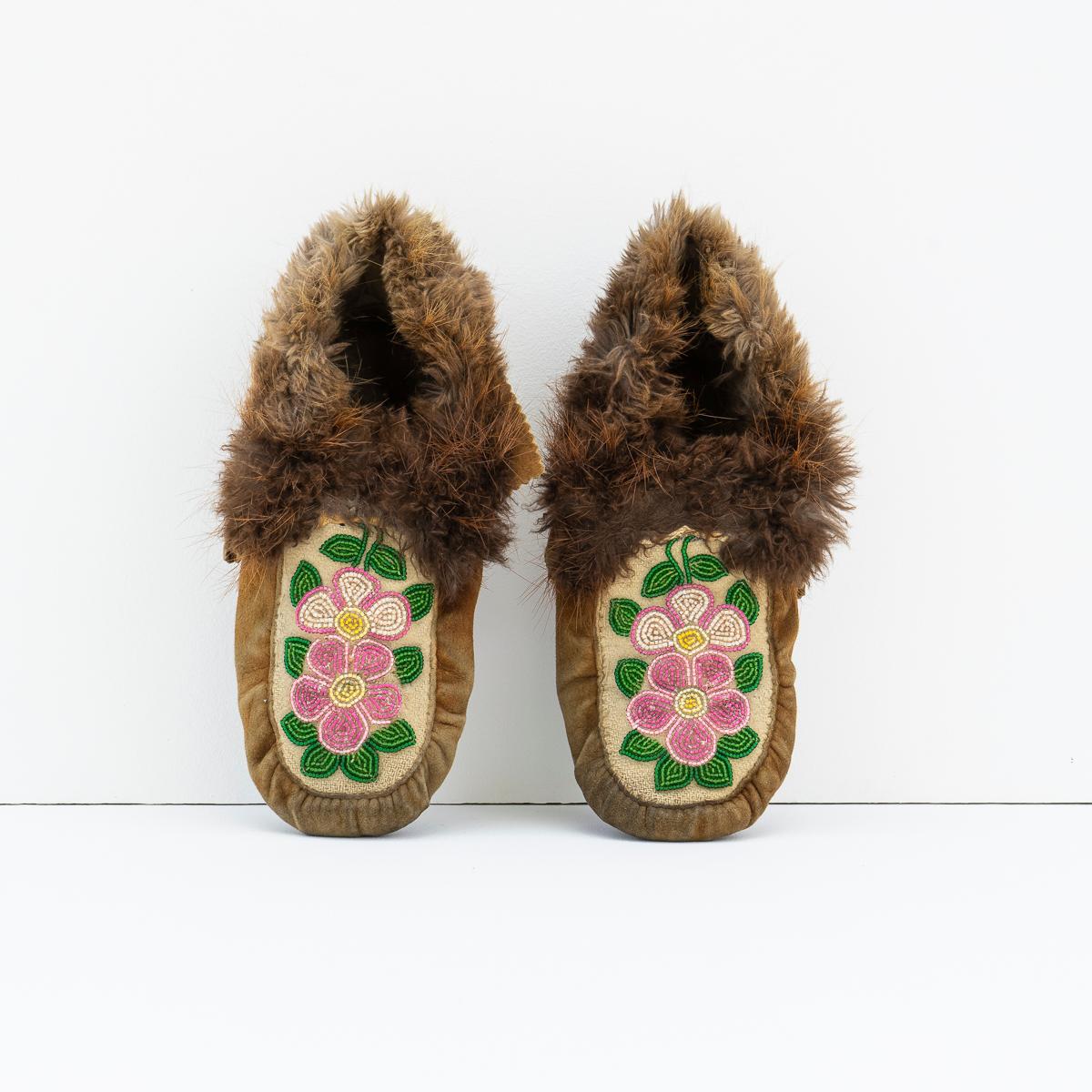 TRADITIONAL OJIBWAY TRIBAL SHOES WITH FLORAL BEAD DETAILING
Originating from the Ojibwe (Ojibwa) people from what is currently Southern Canada and the North Mid-Western United States.

Handmade from smoked moose leather with fur