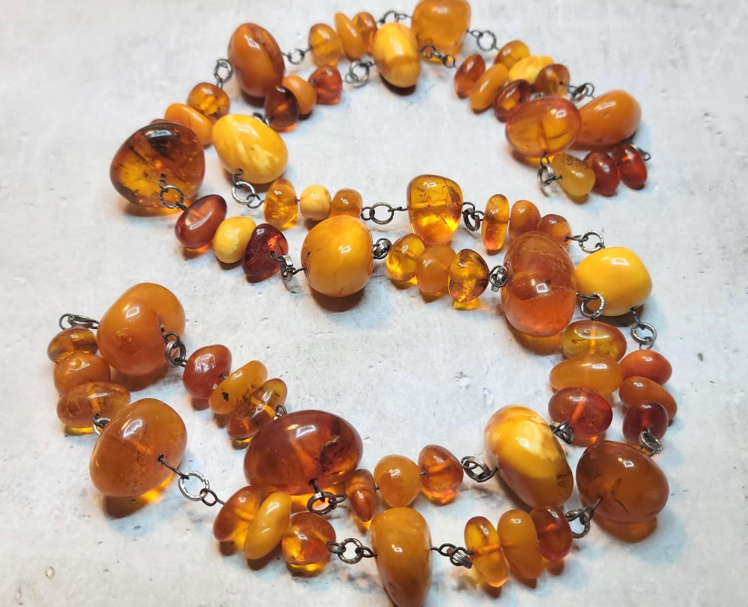 This necklace features a lovely strand of genuine Baltic Healing Amber irregular beads. Very lightweight, and though the beads are chunky, they are not heavy at all. 

Color: butterscotch, egg yolk, cognac. 
Untreated, slightly polished, old pieces