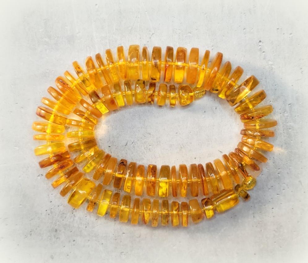 The length of the necklace is 19.5 inches (50 cm). Live chopped pieces disks of natural transparent Baltic amber. The size varies from 10 to 22 mm.
The color of amber is honey and transparent.
The color is authentic and natural. 100% Natural Baltic