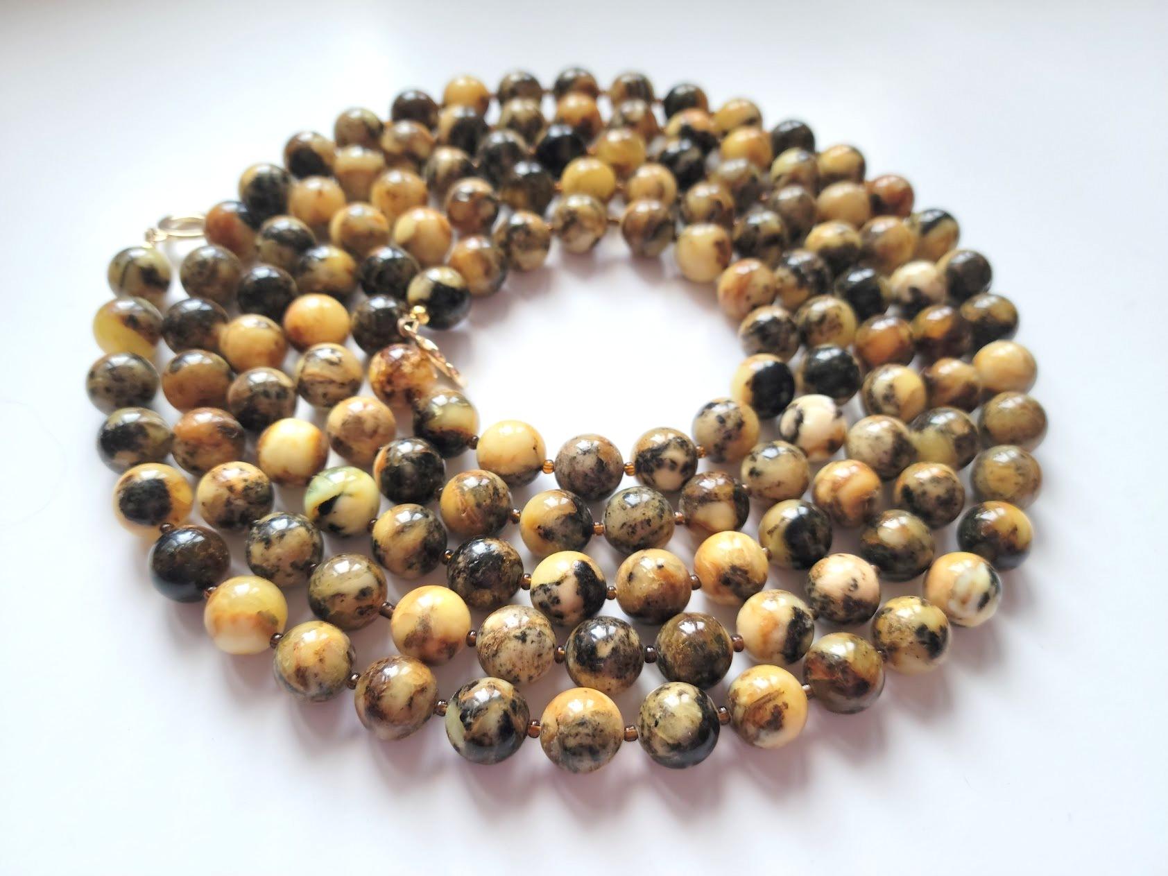 The length of the necklace is 70 inches ( 177.8 cm). Beautiful beads from rare genuine Baltic amber. The size of the beads is 12 mm.
The 