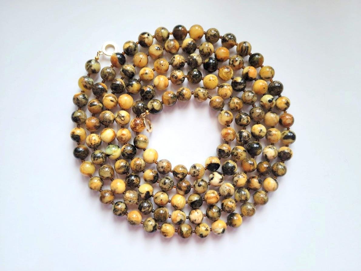 The length of the necklace is 70 inches ( 177.8 cm). Beautiful beads from rare genuine Baltic amber. The size of the beads is 12 mm.

The 