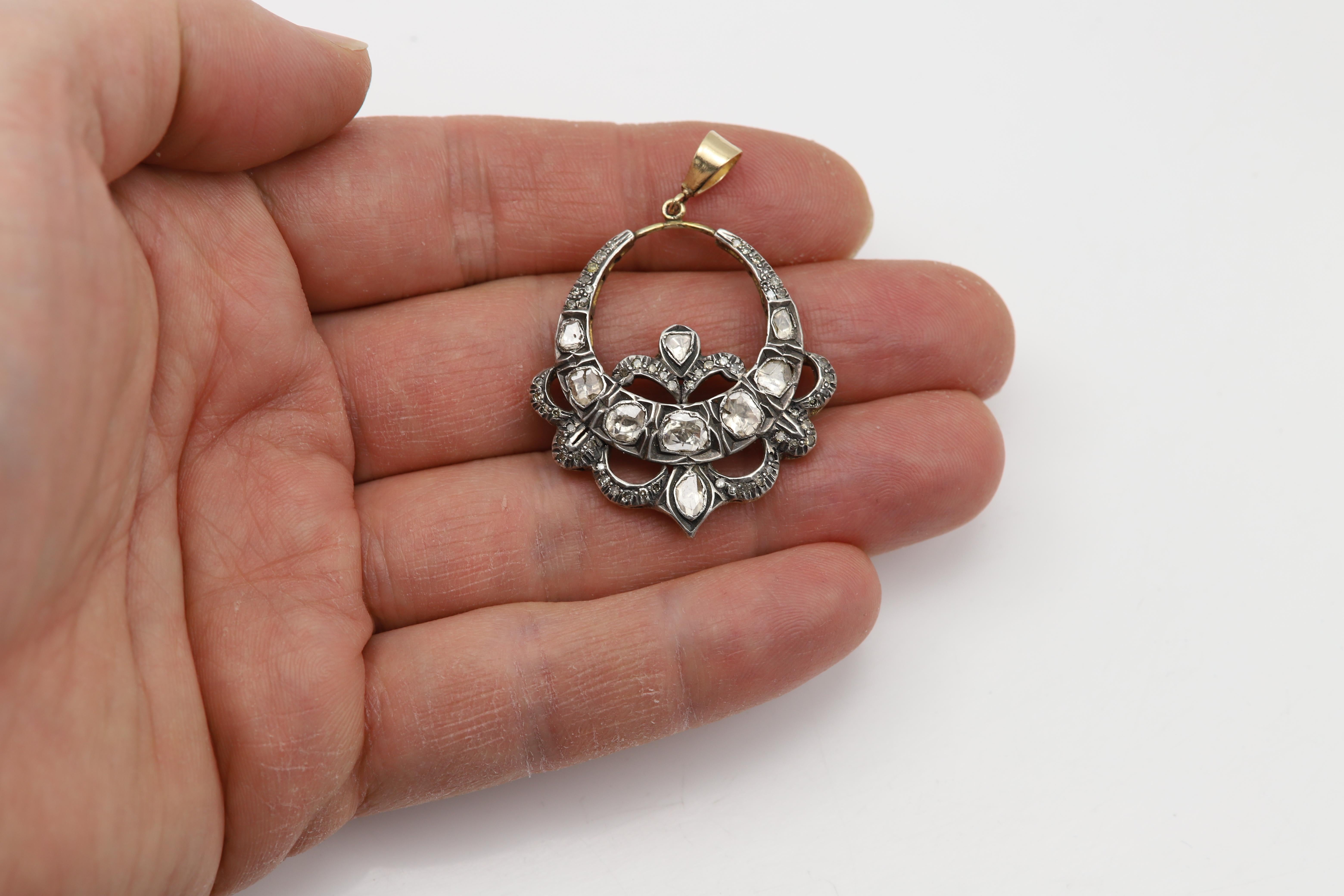 Very Old Vintage Gold and Silver Pendant
Made from two very old Earrings, made into a large Pendant.
Circa 1920's
Size approx 1.5' Inch In Diameter.
Weight: approx 8.7 grams
Mix of Natural Diamonds called 