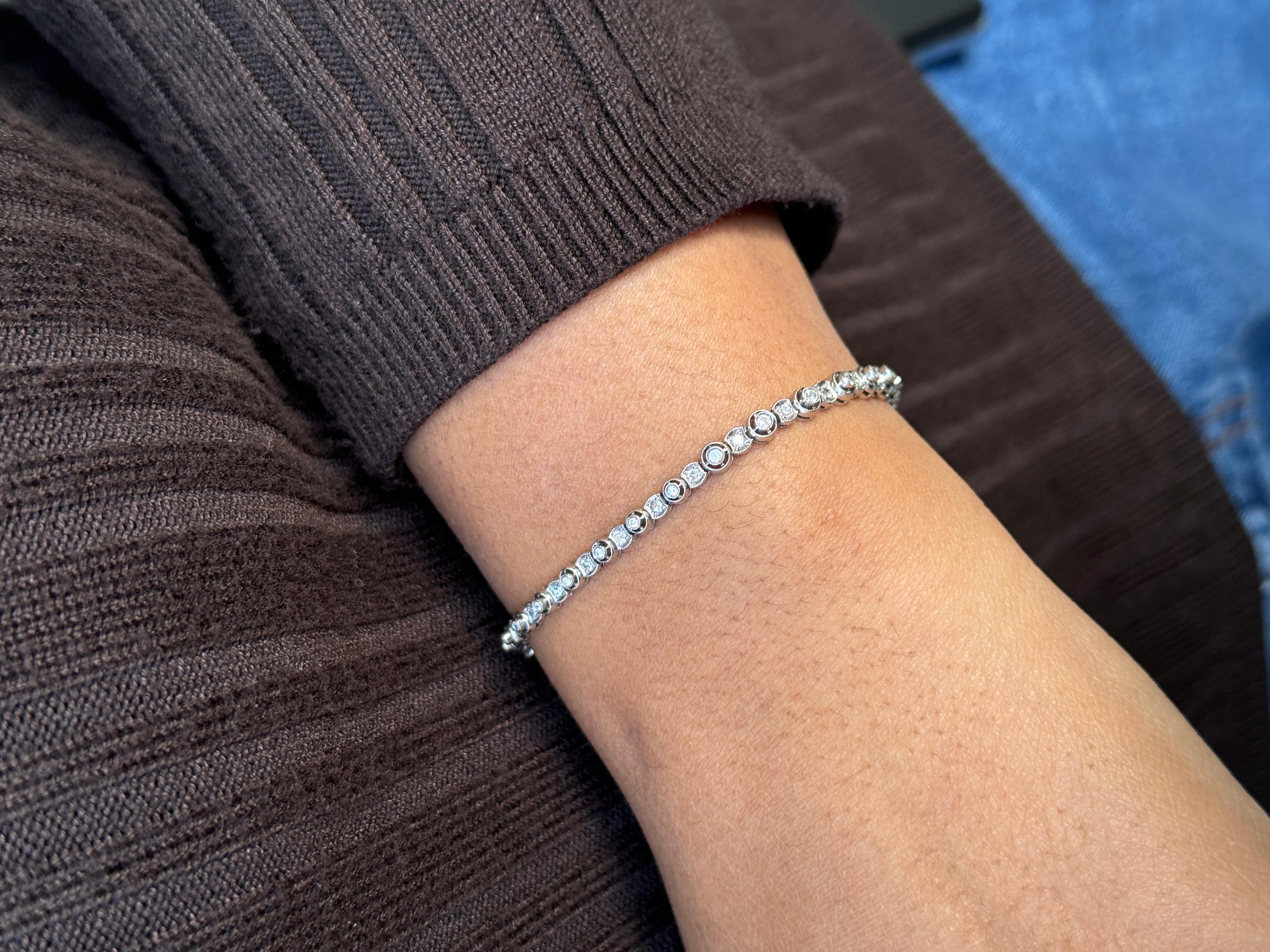 Round Cut Vintage Old Cut Diamond and Platinum Graduated Tennis Bracelet, circa 1930s For Sale
