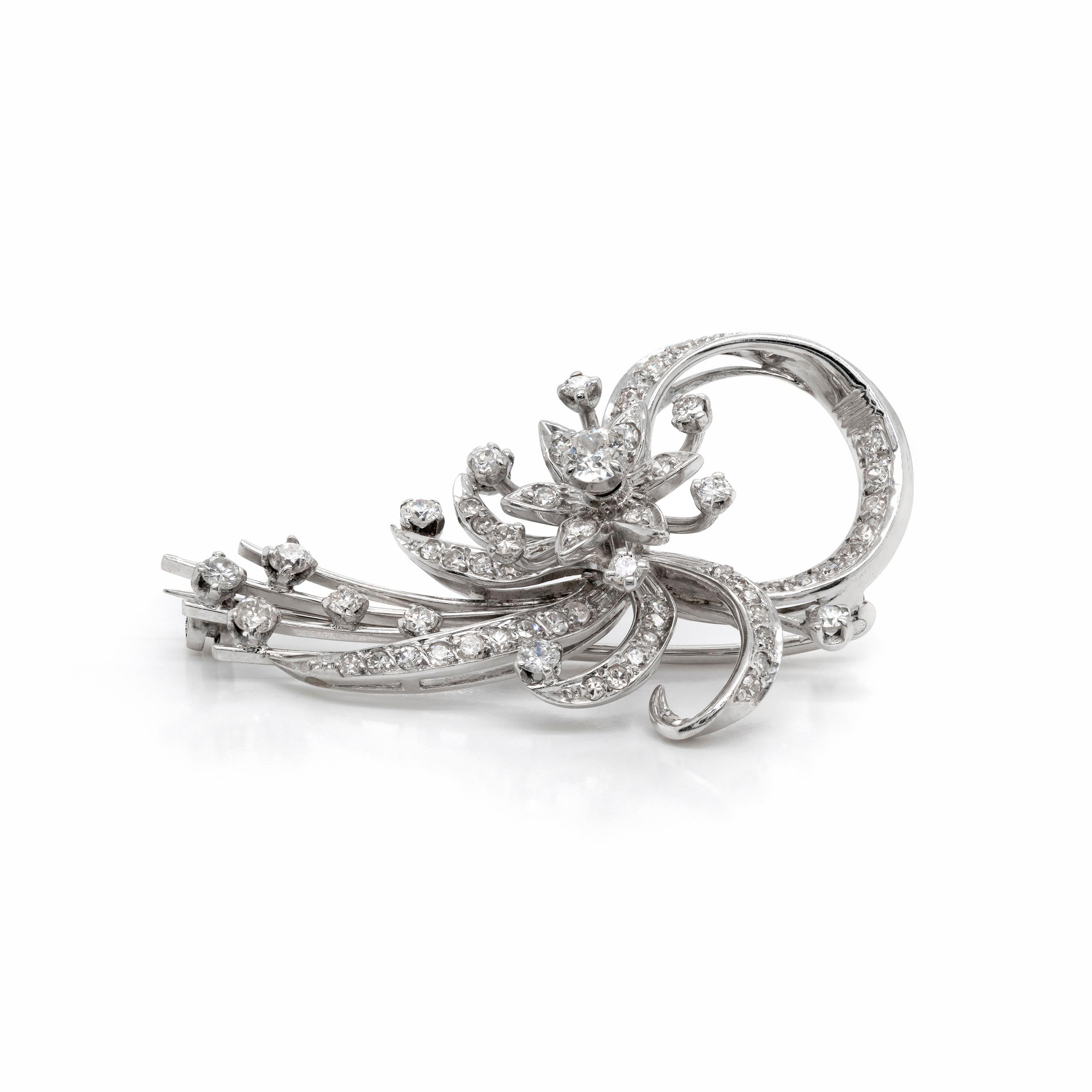 This gorgeous 1950's floral spray brooch is beautifully grain and claw set with a mixture of 68 old cut and eight cut diamonds totalling to an approximate weight of 2.10 carats, all mounted in platinum.

The detailing on this brooch is exquisite -