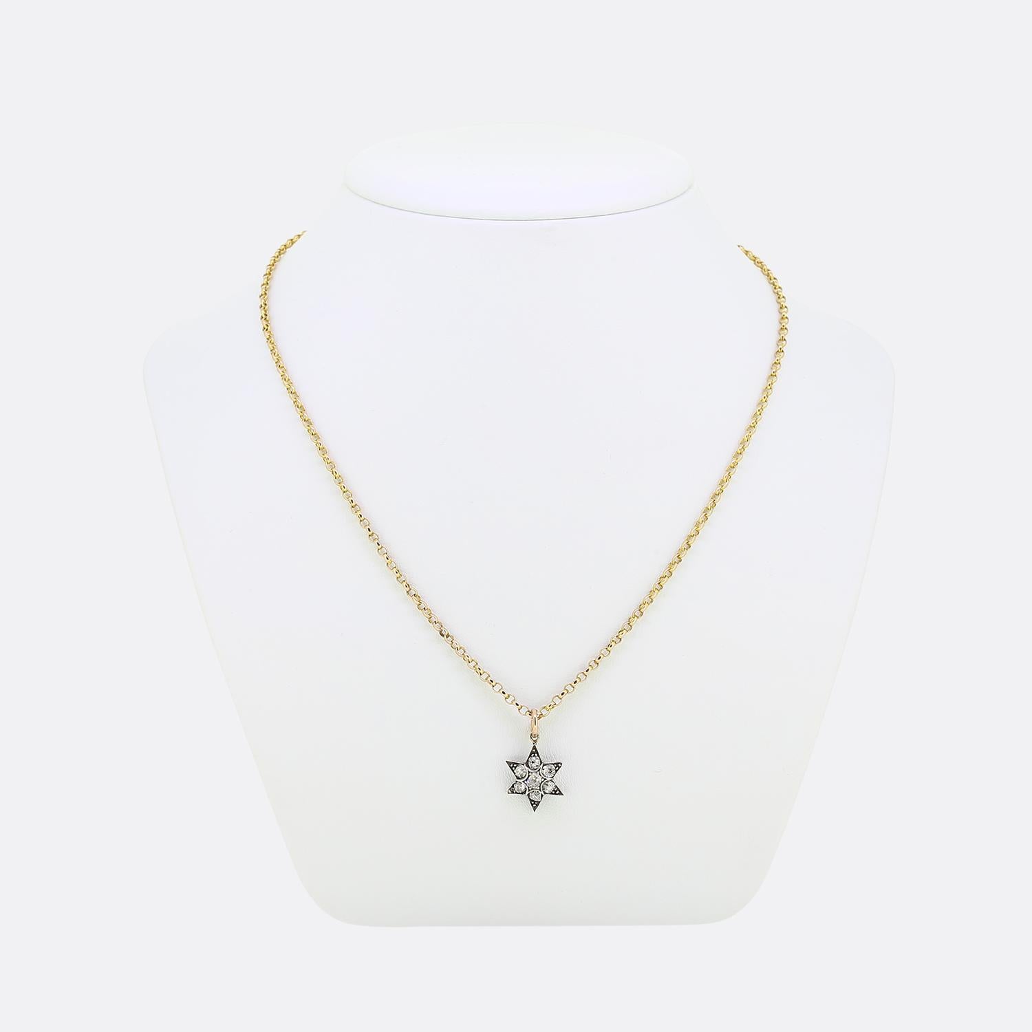 Here we have a stunning diamond set pendant necklace. This pendant has been crafted from sterling silver into the shape of six pointed, multilayered star. Each point has been individually claw set with a single old cut diamond with a matching stone