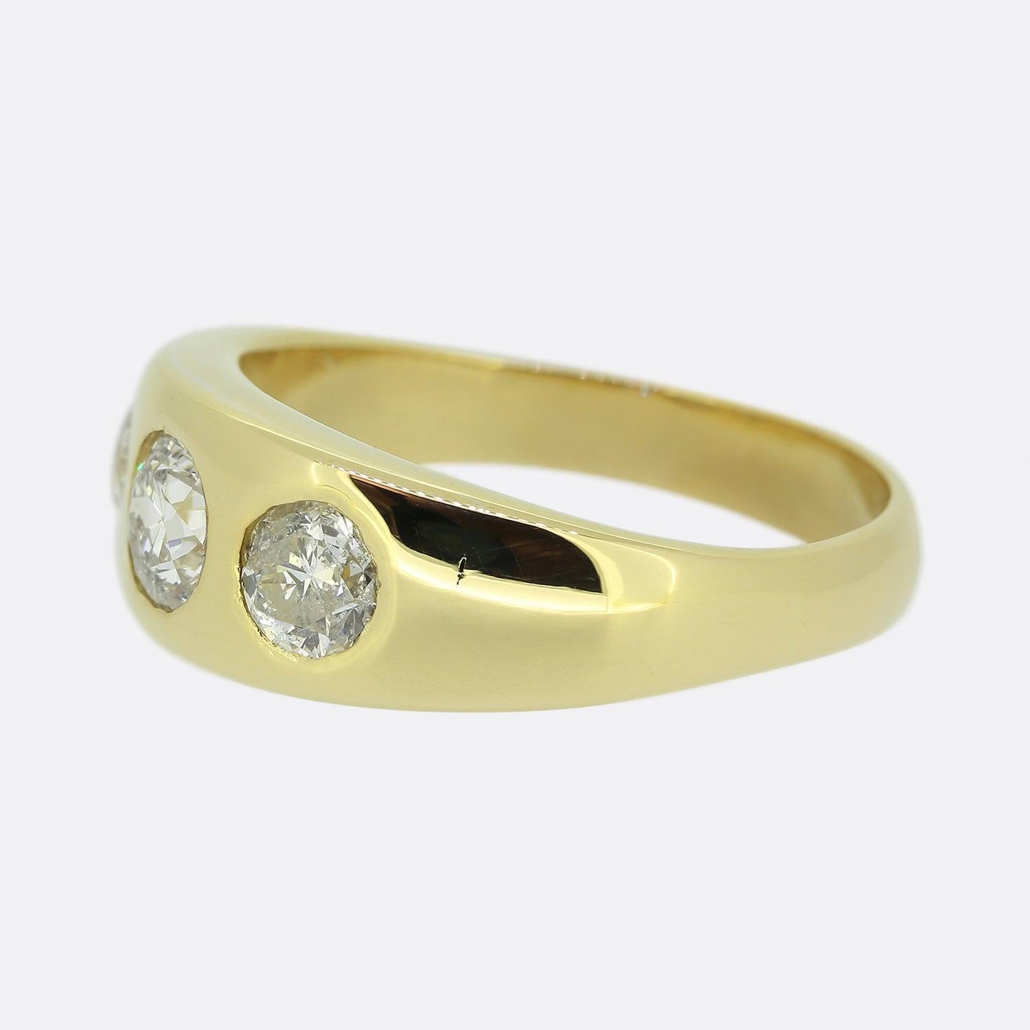 Here we have a vintage old cut diamond three stone ring. The ring is crafted in 18ct yellow gold and features three old European cut diamond the largest of which sits in the centre. The diamonds are well matched for colour and clarity and are bezel