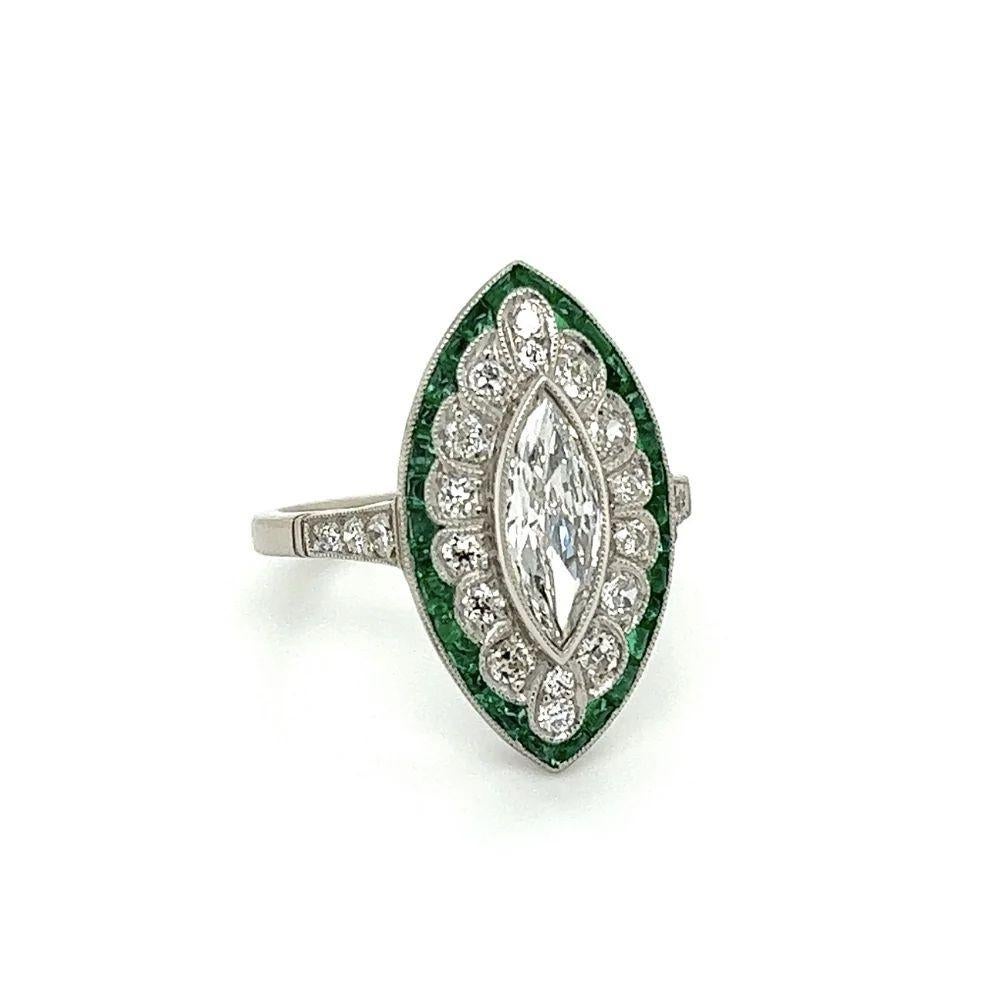 Simply Beautiful! Finely detailed Exquisite Marquise Diamond and Emerald Cocktail Ring. Centering a securely nestled Hand set 0.70ct Old Cut Marquise Diamond surrounded by Round Diamonds, weighing approx. 1.34tcw and Emeralds, approx. 0.80tcw. Hand