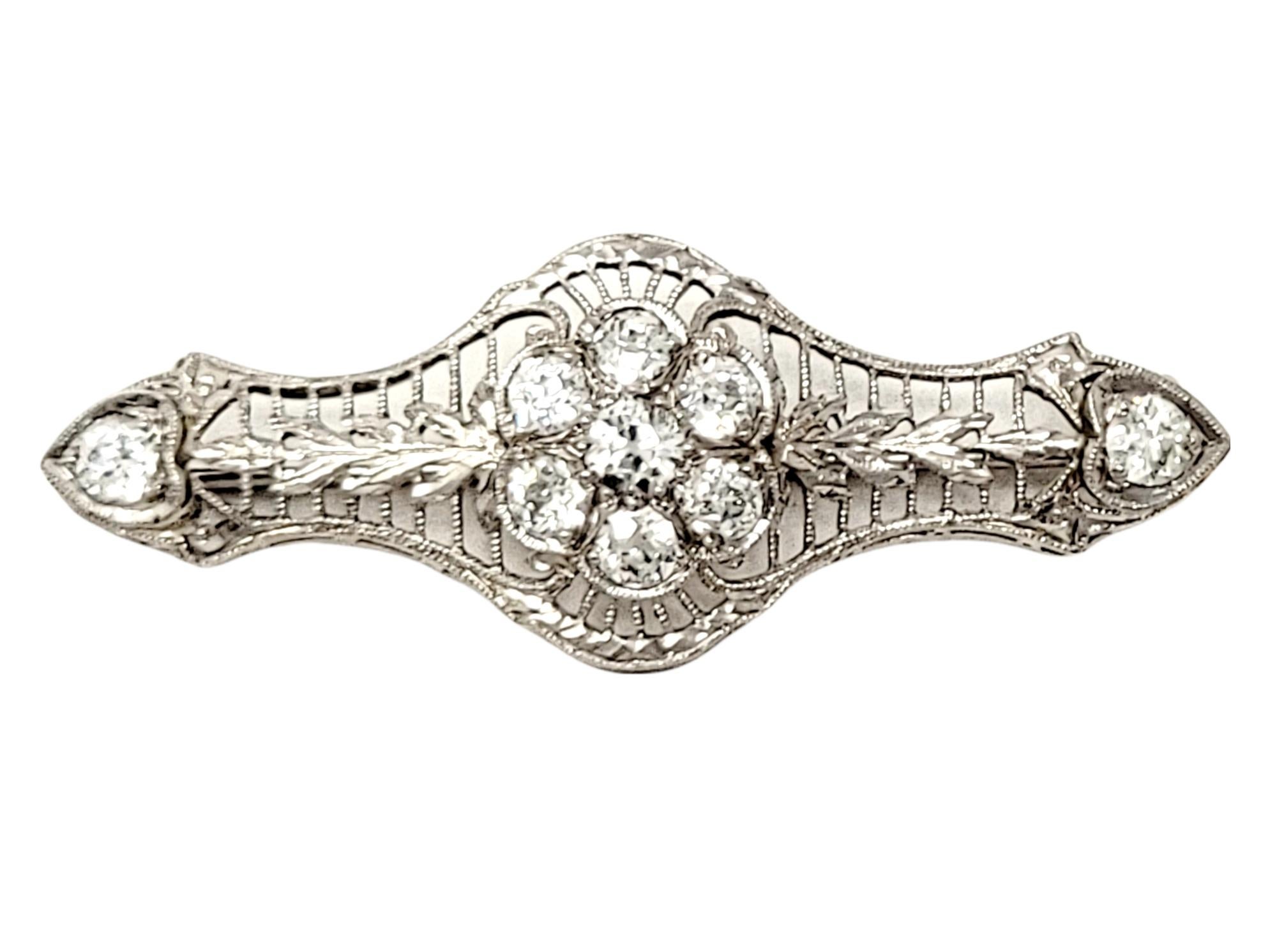 Gorgeous sparkling vintage diamond brooch with an intricate open filigree design throughout. 

Metal: 18K White Gold
Closure: Hinged stick pin
Natural Diamonds: 1.26 ctw 
Diamond Cut: Old European
Diamond Color: G-H
Diamond Clarity: VS-SI
Length: