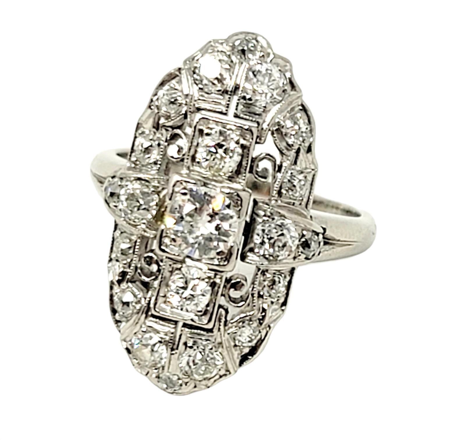 Ring size: 5.75

Incredible vintage diamond ring is the essence of old world glamour. The unique shape and impeccable detail work make this a truly special piece. The ring features a single sparkling round Old European cut diamond prong set in a