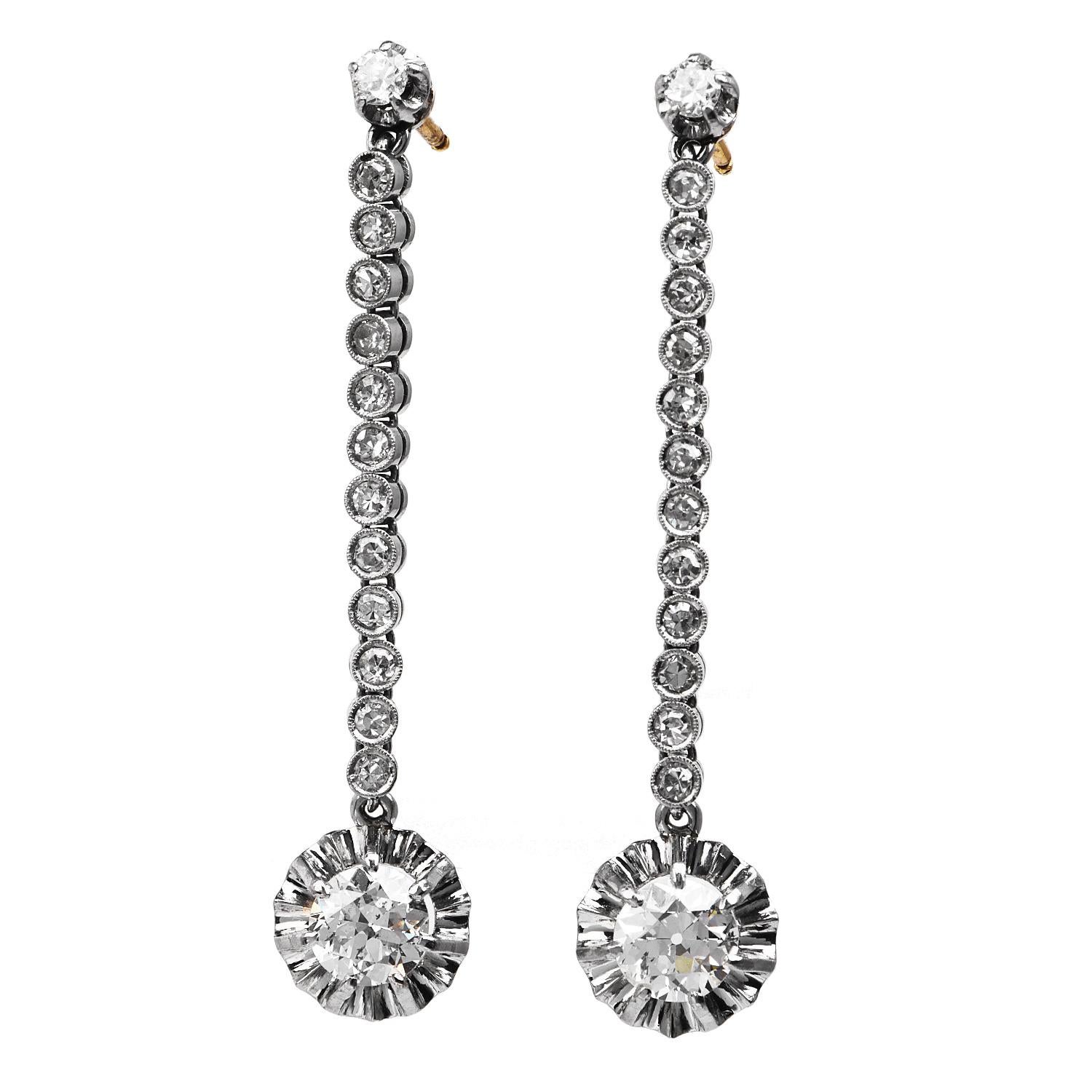 Charm those around you with these lovely Vintage Diamond Platinum Old European Drop Dangle Earrings,

these delightful earrings are crafted in luxurious platinum with Yellow gold pushbacks.

They host in each center two prominent old European cut,