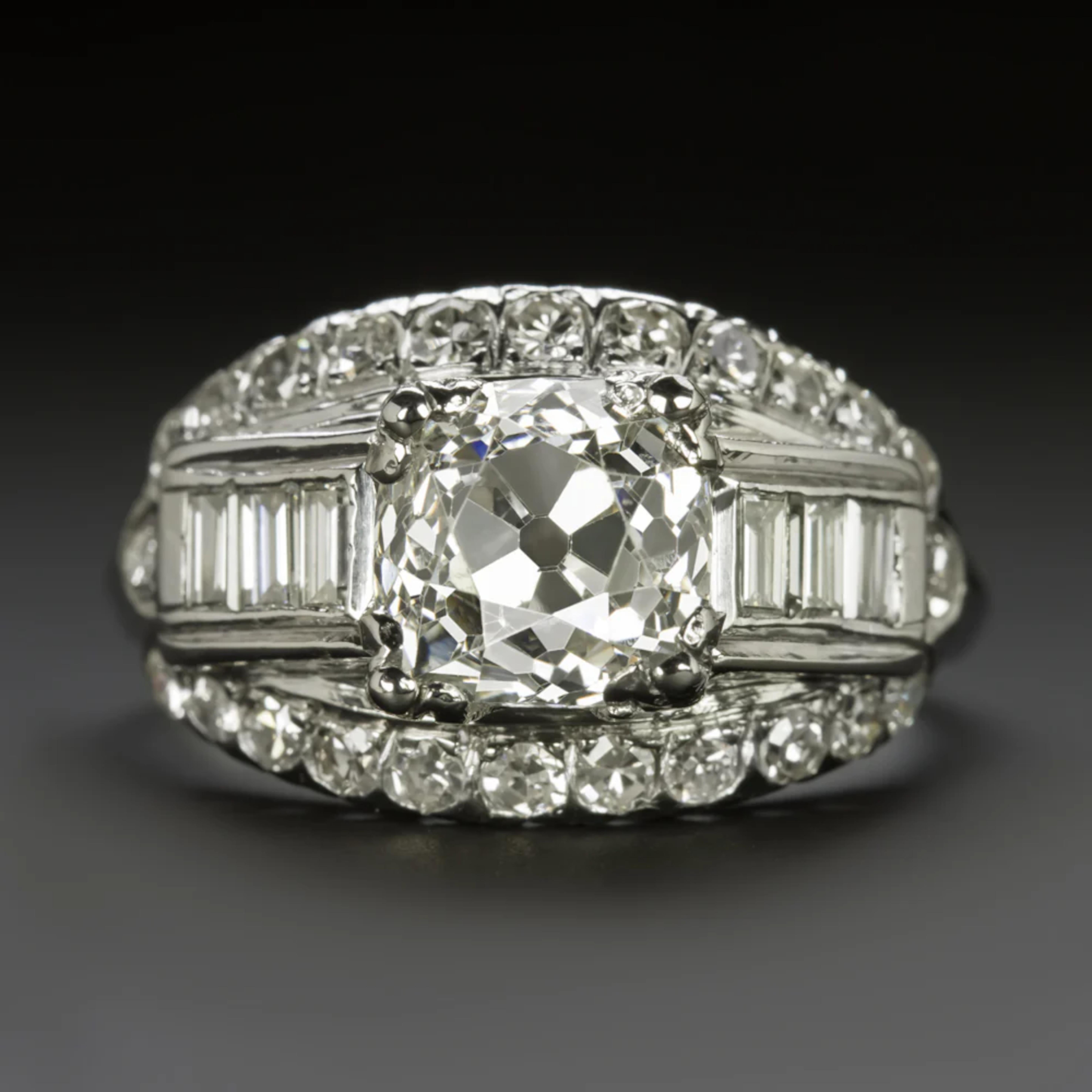 vintage diamond engagement ring, meticulously handmade featuring stunning diamond-studded details and a captivating old mine cut center diamond. This original vintage piece showcases a striking 2.17 ct old mine cut diamond that stands out