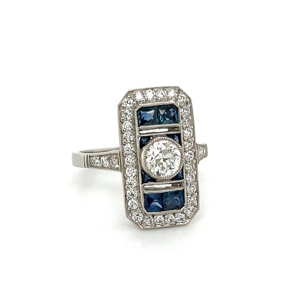 Simply Beautiful! Elegant and finely detailed GIA Diamond and Sapphire Vintage Platinum Cocktail Ring. Centering a securely nestled Hand set GIA 0.54 Carat Old European Cut Diamond; GIA I-VS1. Framed by 1.28tcw French Cut Sapphires and adding a