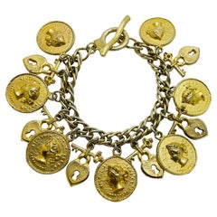 Vintage old gold tone coin heart lock key charm chain toggle designer brooch